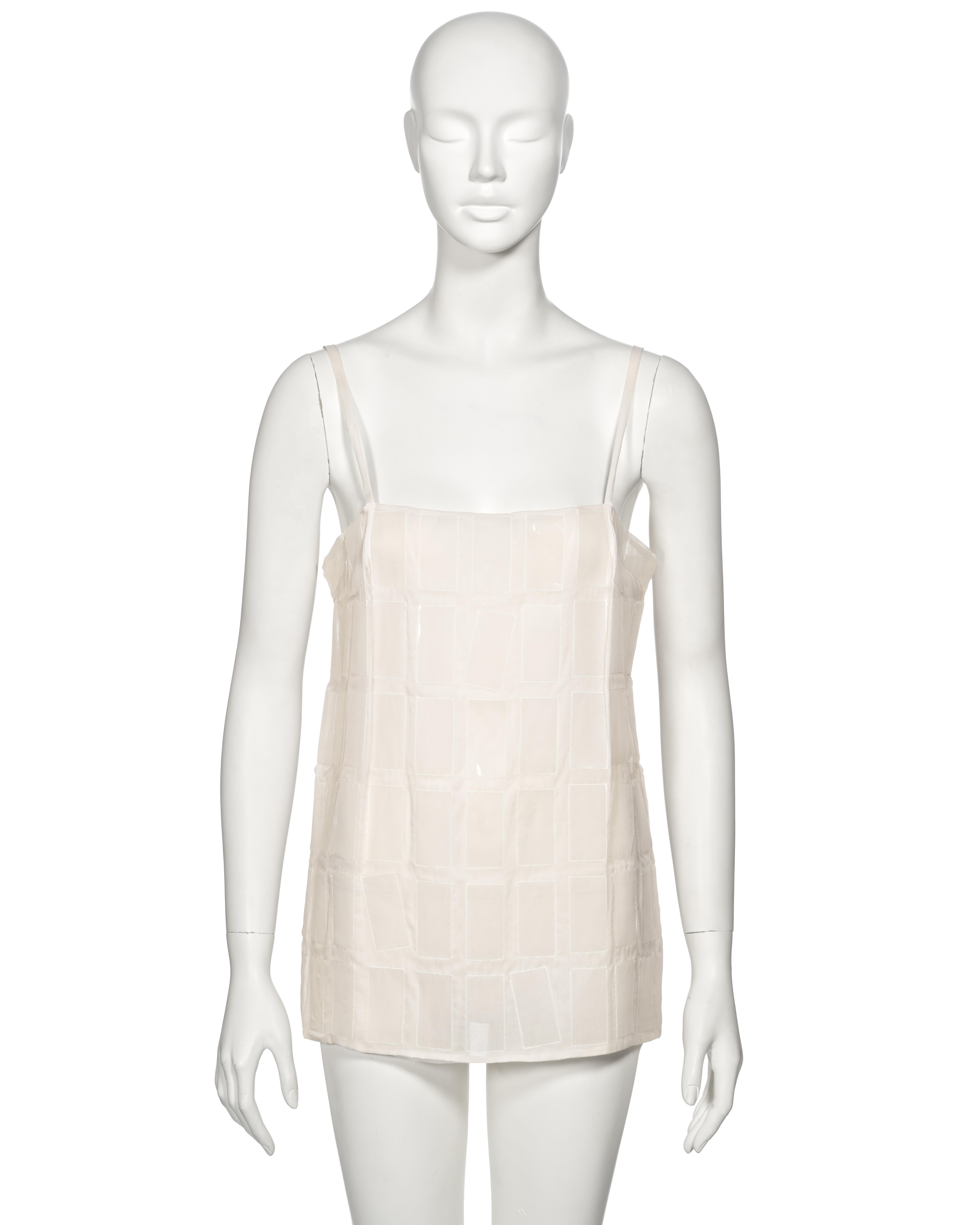 ▪ Archival Prada Camisole Top
▪ Creative Director: Miuccia Prada
▪ Fall-Winter 1998
▪ Sold by One of a Kind Archive
▪ Museum Grade 
▪ Constructed from white silk organza 
▪ Adorned with incased clear plastic sheets / tiles  
▪ Straight neckline  
▪