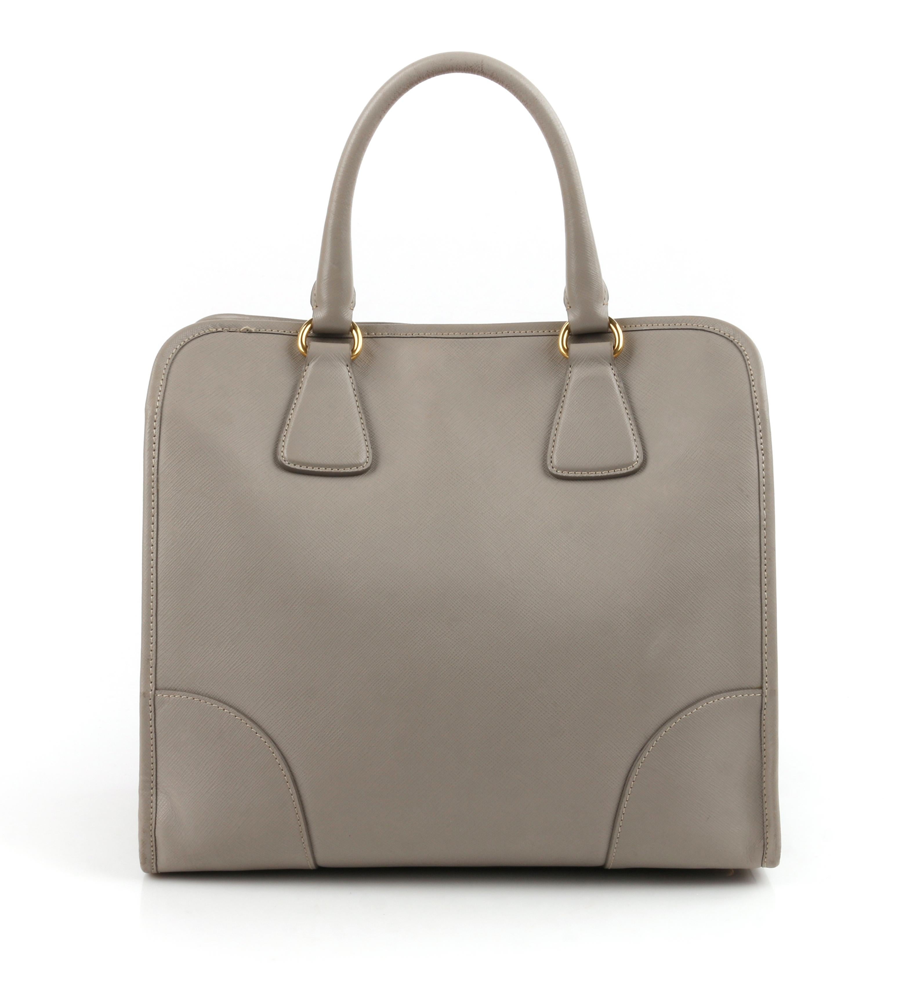 PRADA c.2011 “Saffiano Lux” Pomice Grey Leather Tote + Strap Large Handbag

Estimated Retail: $2390
 
Brand / Manufacturer: Prada
Manufacturer Style Name: Saffiano Lux
Style: Handbag, shoulderbag, top handle bag, tote
Color(s): Pomice
Lined: