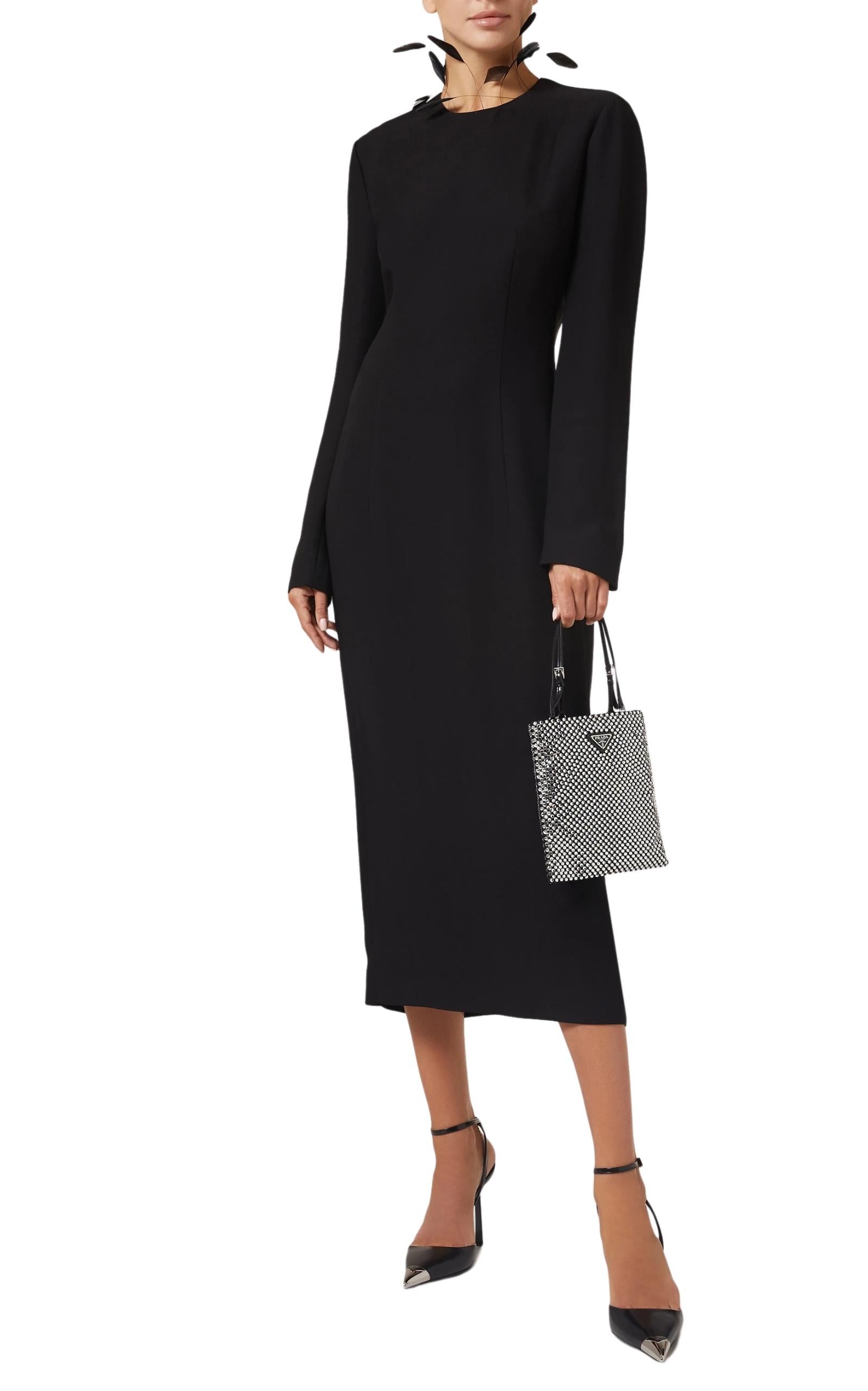 Cady Feather Embellished Midi Dress.
Sheath dress 
Turtleneck 
Back zipper closure 
Long sleeves 
Back slit 
Straight hem 
Detachable feather collar detail
Material: 100% Viscose
Lining, 60% Cuoro, 40% Silk
Made in Italy