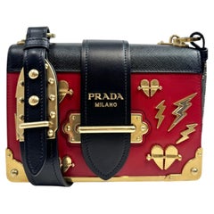 Prada Cahier bag calfskin red black charm