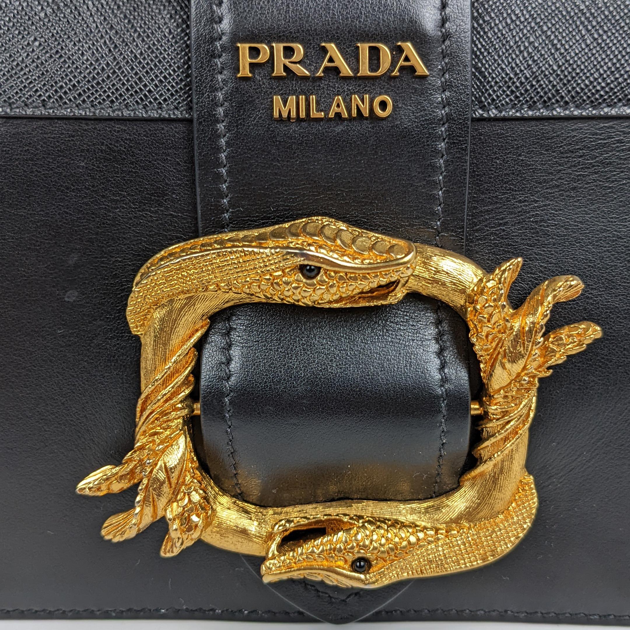 Condition: This super rare and authentic Prada bag is in great pre-loved condition. There is minor tarnishing/scratches to the hardware and light scratches to exterior leather and under flap. Some relaxing to bottom leather.

Includes: Authenticity