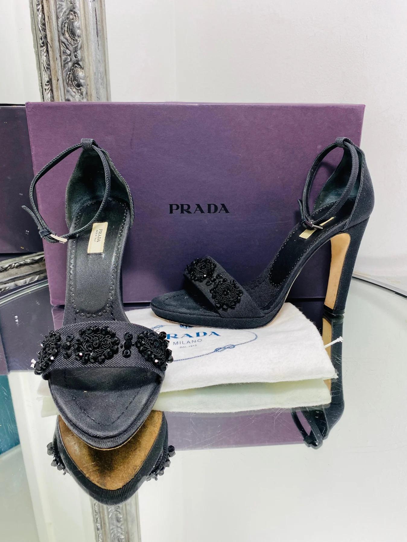 Prada Calzature Donna Heels Covered with Denim

Designed with black crystal embellishment to the strap. Featuring ankle buckle strap and 11cm.

Additional information:
Size – 38
Condition – Very Good
Comes with- Box, 2 Dust Bags