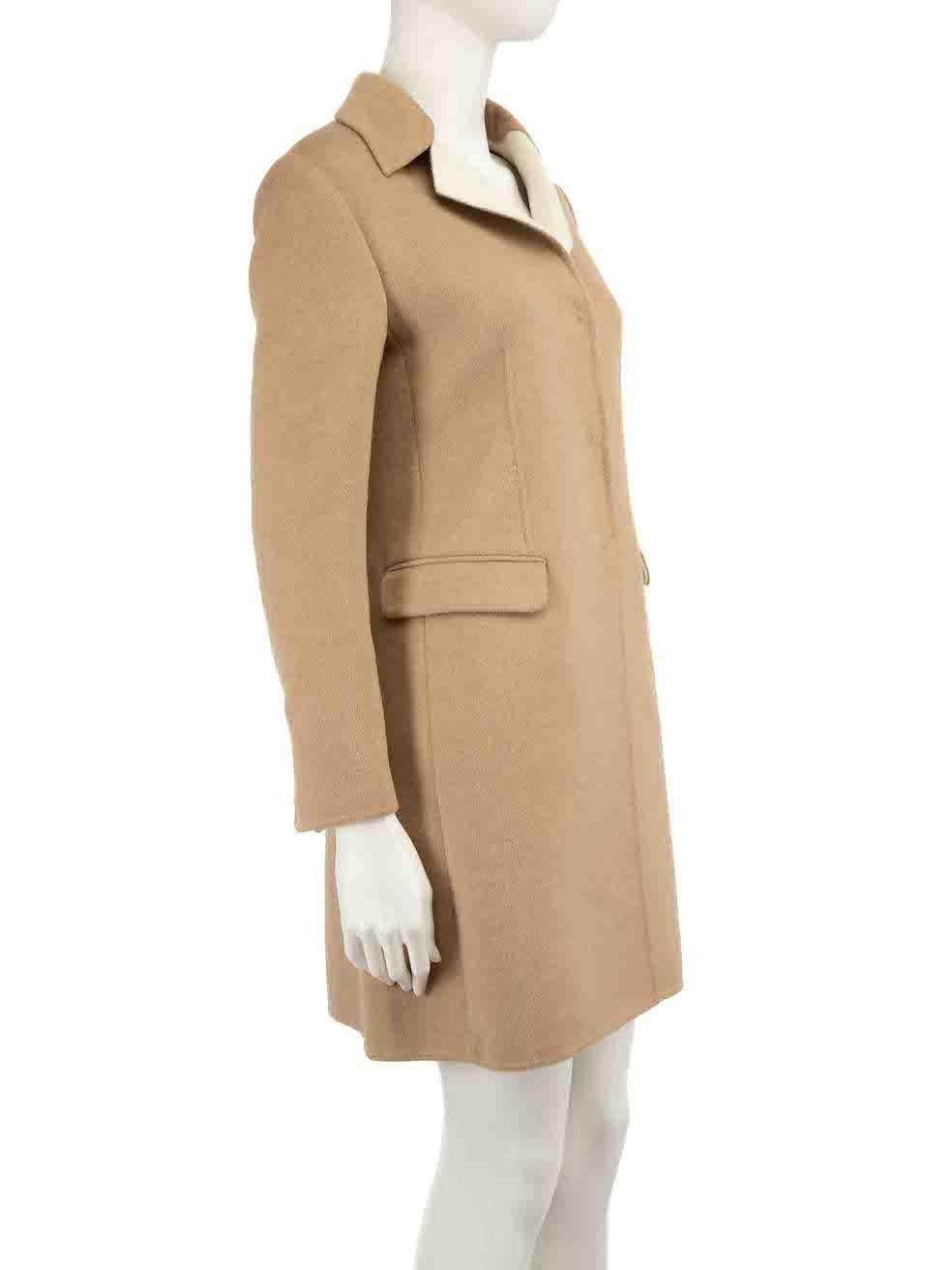 CONDITION is Very good. Hardly any visible wear to coat is evident on this used Prada designer resale item.
 
 
 
 Details
 
 
 Camel
 
 Brushed wool
 
 Coat
 
 Single breasted
 
 Snap button fastening
 
 Buttoned cuffs
 
 2x Front pockets
 
 
 
 
