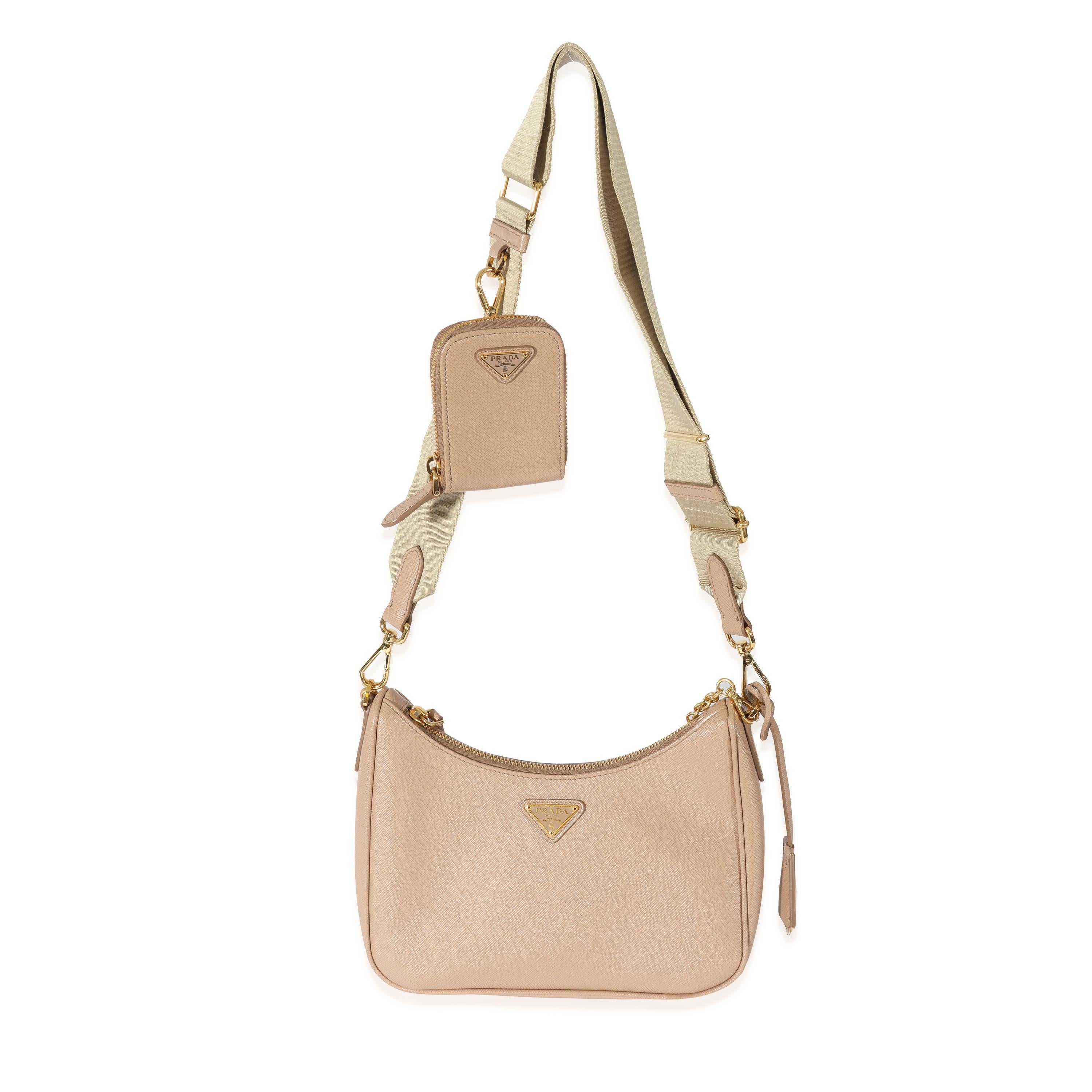 Listing Title: Prada Cameo Beige Saffiano Re-Edition 2005
 SKU: 128557
 MSRP: 2490.00
 Condition: Pre-owned 
 Handbag Condition: Very Good
 Condition Comments: Very Good Condition. Creasing and light scuffing to leather. Scratching to hardware.
