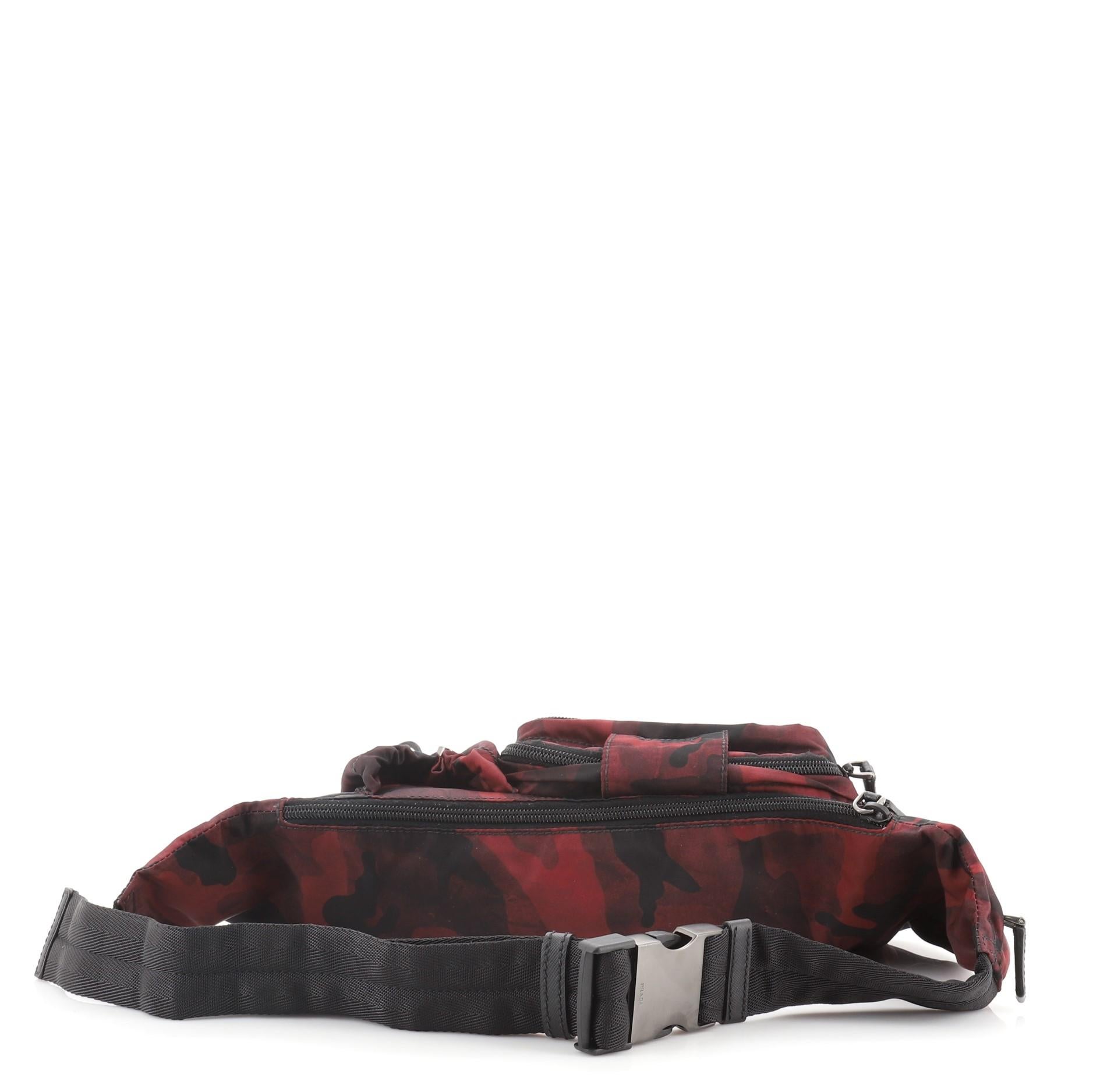 Prada Camo Waist Bag Tessuto
Black, Red

Condition Details: Minor wear on strap and openig corners, scratches on hardware.

52020MSC

Height 6