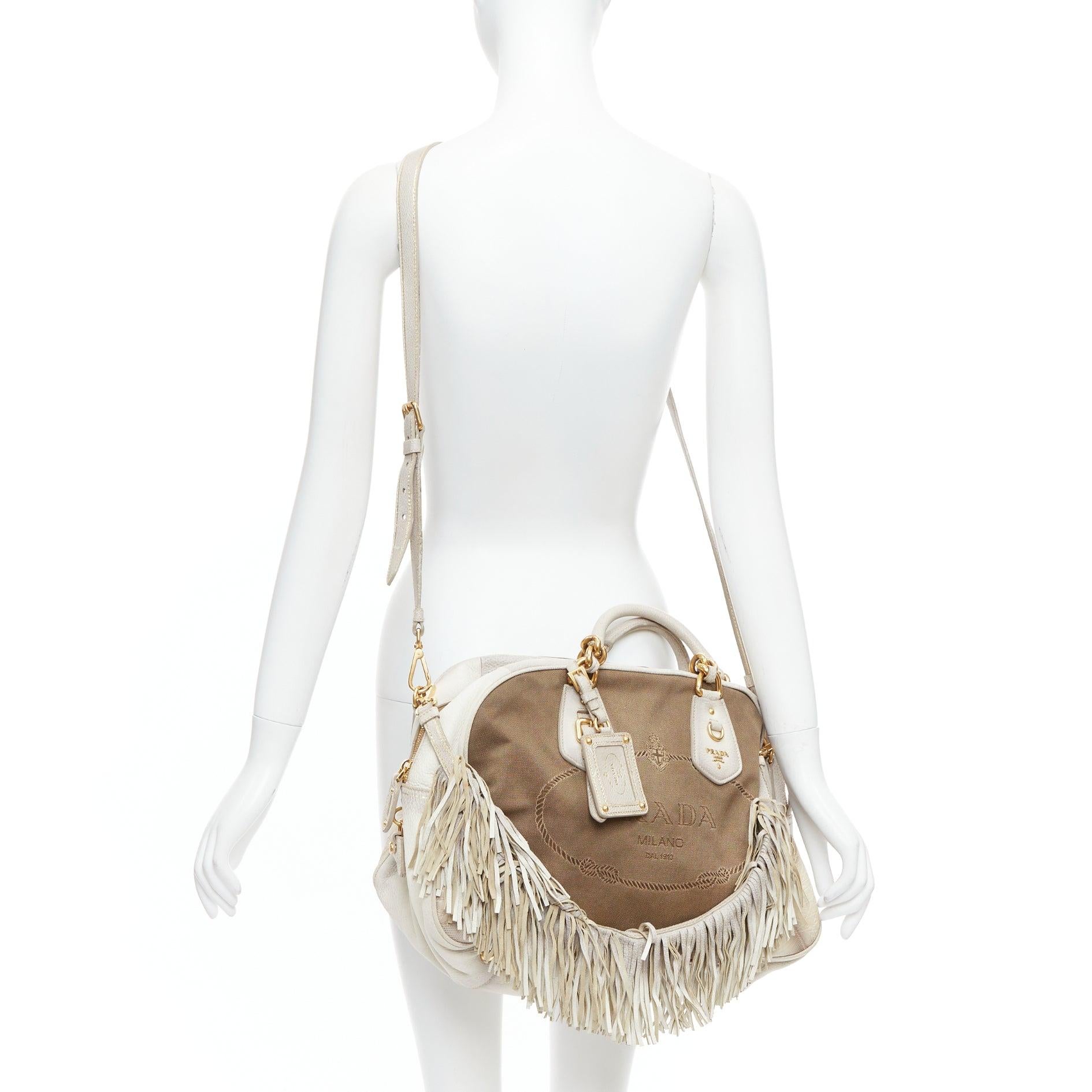 PRADA Canapa Jacquard Logo Cervo Fringe Bowler Corda Talco canvas bag
Reference: PYCN/A00113
Brand: Prada
Designer: Miuccia Prada
Model: Canapa
Material: Leather, Canvas
Color: Cream, Brown
Pattern: Solid
Closure: Zip
Lining: Beige Fabric
Extra