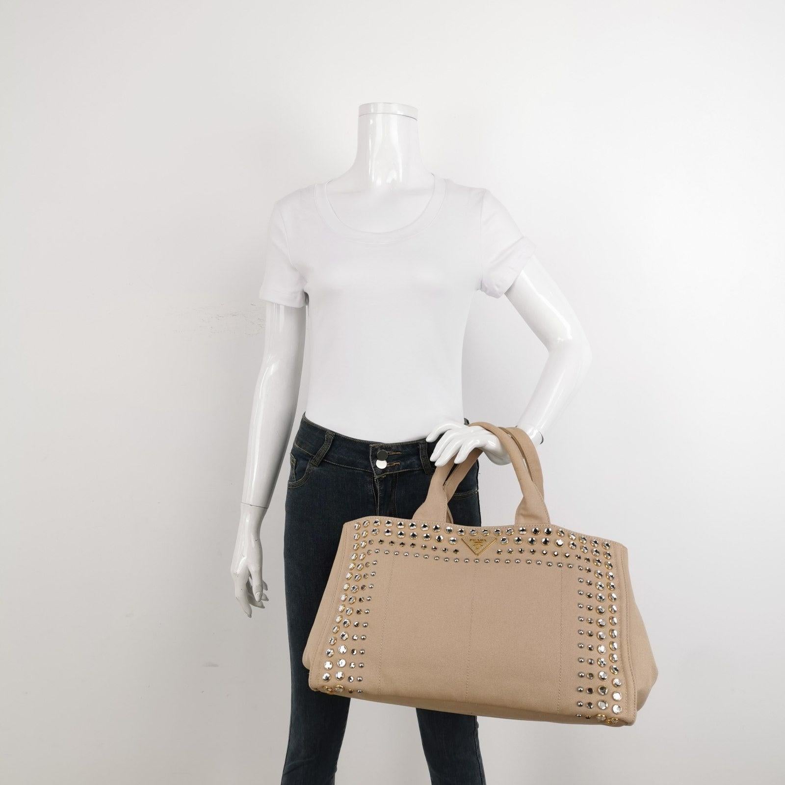 Prada Canape Canvas Tote Beige Top Handle Bag with Jewels These are professional photos of the actual bag offered by Luxbags. Hemp fabric bag with silk-screened Prada logo and classic enamel triangle logo on the sides. Inside, three pockets and a