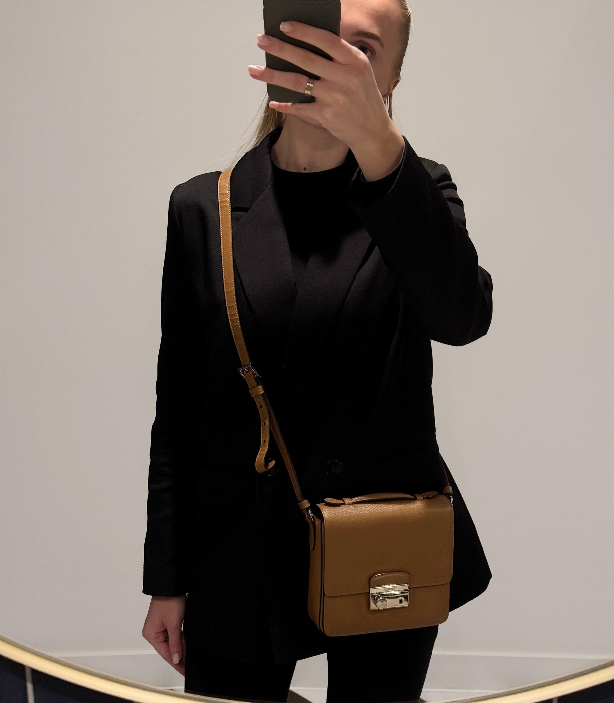 Prada Caramel Saffiano Lux Leather Small Sound Crossbody Bag

Product Details
Xupes Ref: CB1440
Brand: Prada
Model: Small Sound Crossbody Bag
Type: Shoulder, Crossbody, Top Handle 
Serial Number: 180
Age: 2015
Accompanied By: Prada Dust Bag,