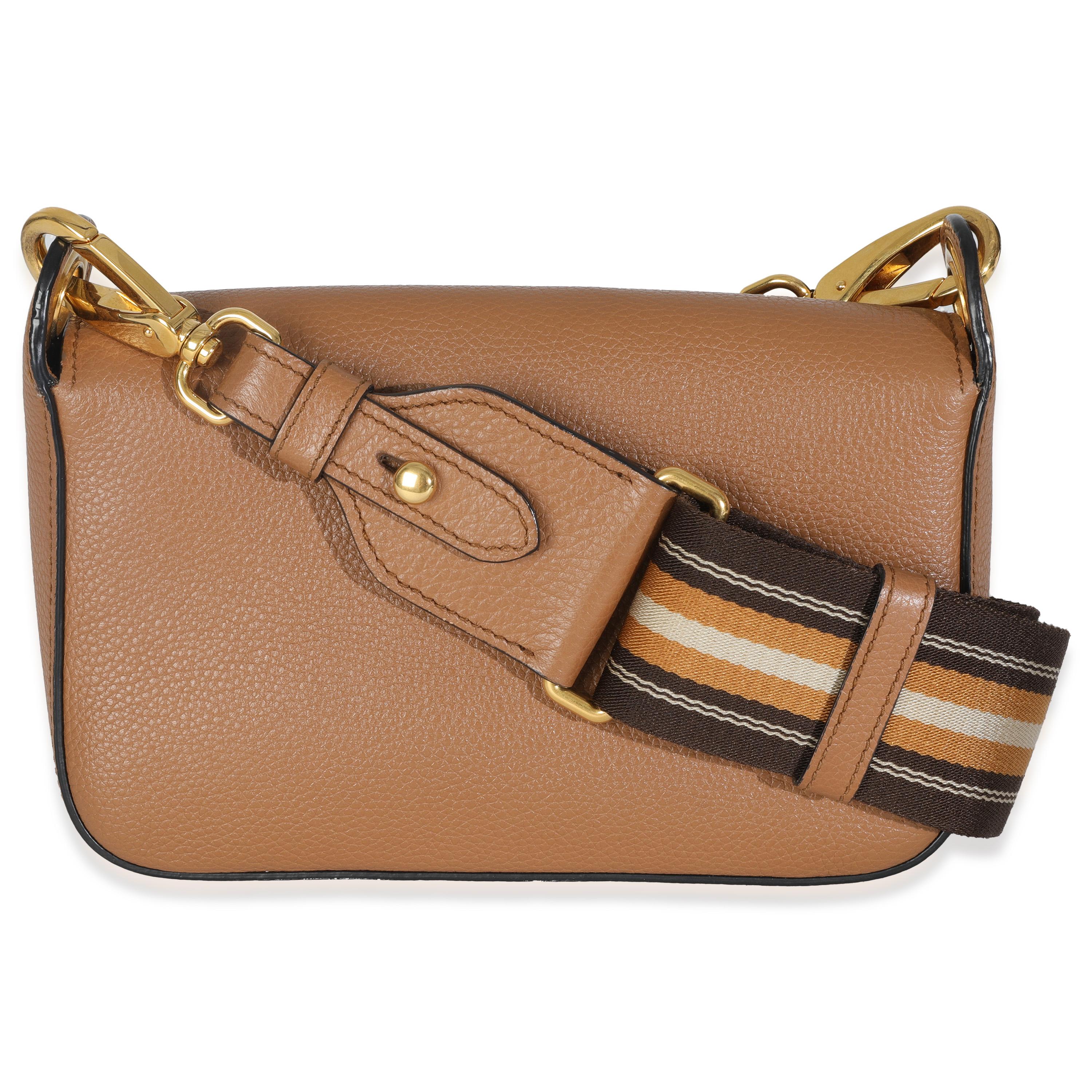 Listing Title: Prada Caramel Vitello Daino Camera Crossbody
SKU: 146831
Condition: Pre-owned 
Handbag Condition: Excellent
Condition Comments: Item is in excellent condition and displays light signs of wear. Light scratches and wear along exterior.