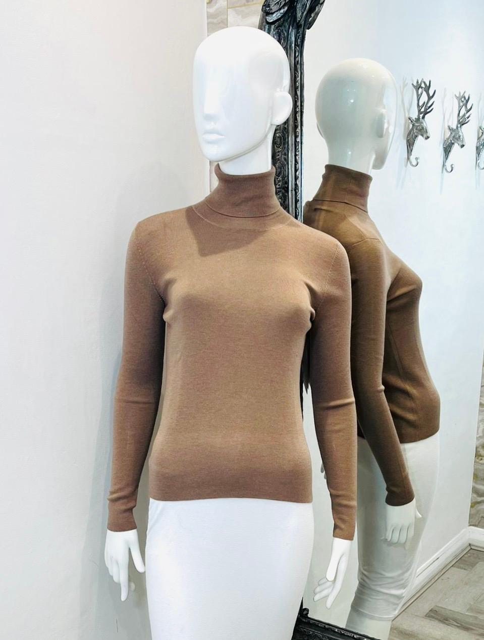 Prada Cashmere & Silk Rollneck Jumper

Light brown, luxurious soft jumper designed with roll-neckline.

Featuring fitted silhouette and long sleeves. Rrp £612

Size – 40IT

Condition – Excellent

Composition – 70% Cashmere, 30% Silk (Labels missing