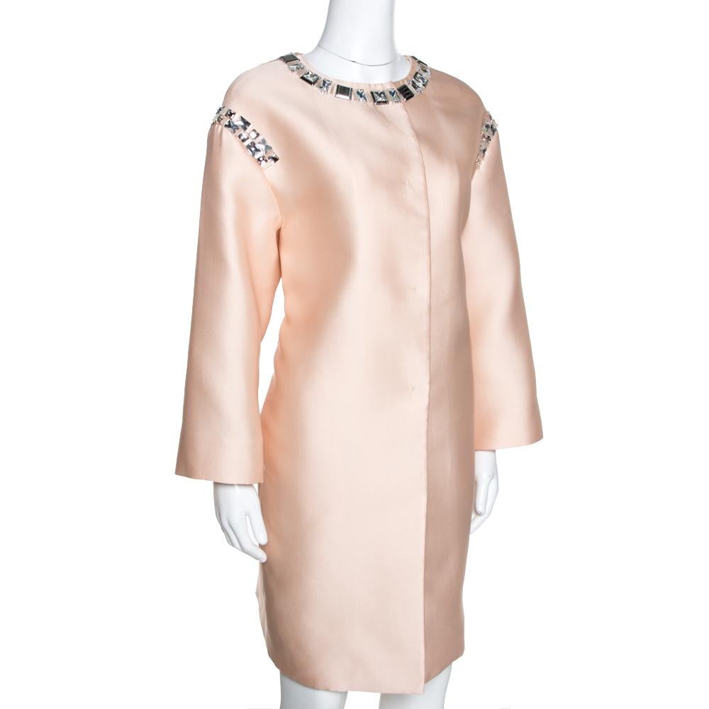 You'll surely love owning this champagne coat from Prada because it has been wonderfully made from satin and beautified with embellishments. The lightweight coat comes with long sleeves and button closure. Its grand design will unceasingly elevate