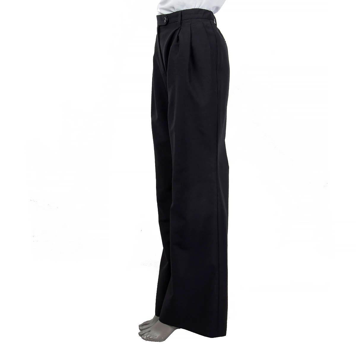 100% authentic Prada mid waist wide-straight leg pants in charcoal mohair (60%) and wool (40%). Features Prada logo embroidery on the inner left side and opens with a black button in the front. unlined. Have been worn and are in very good condition.