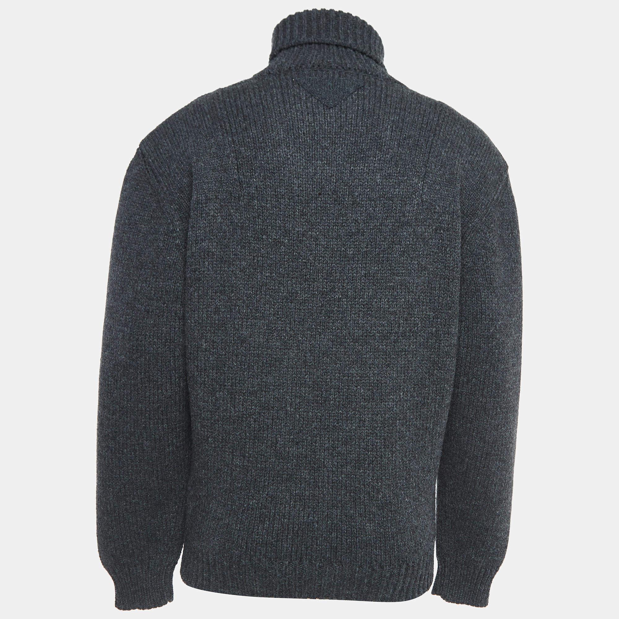The Prada sweater is a luxurious and versatile wardrobe staple. Crafted from high-quality cotton, it features a sophisticated turtleneck. This timeless piece seamlessly blends comfort with elevated style, making it a must-have for any