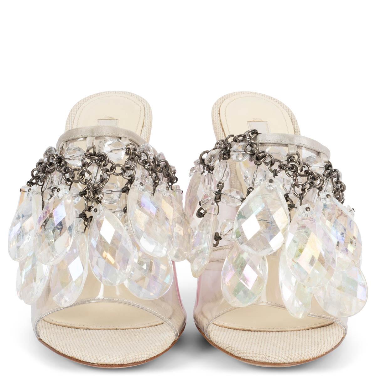 100% authentic Prada Chandalier sandals with clear pvc. Features iridescent crystals embellishments, a pink lucite heel and satin trim. Have been worn once inside and are in virtually new condition. Show some very soft glue stains on the canvas sole