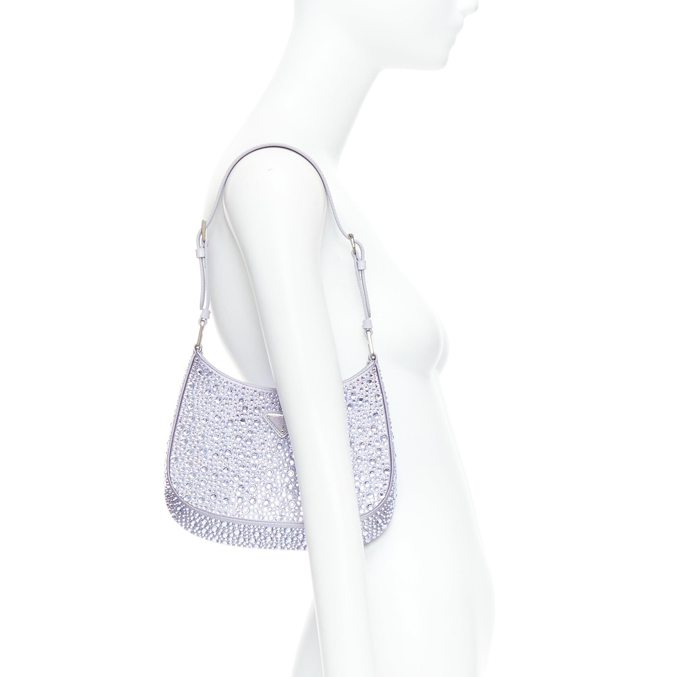 PRADA Cleo blue crystal encrusted satin triangle logo underarm shoulder bag
Reference: LNKO/A02472
Brand: Prada
Designer: Miuccia Prada
Model: Cleo
Material: Fabric
Color: Blue
Pattern: Crystals
Closure: Magnet
Lining: Blue Fabric
Extra Details: