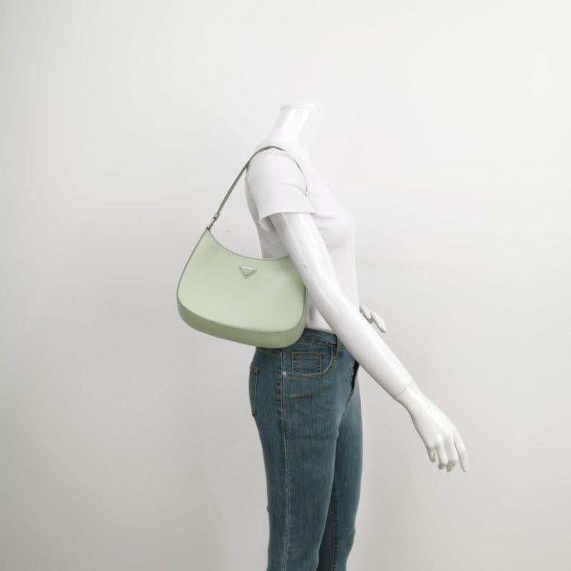 Prada Cleo Green Smooth Leather Shoulder Bag
  These are professional photos of the actual bag offered by Luxbags.
  The Prada Cleo shoulder bag is a timeless classic. It is crafted from a smooth green leather with a mirror glaze shine. Combining