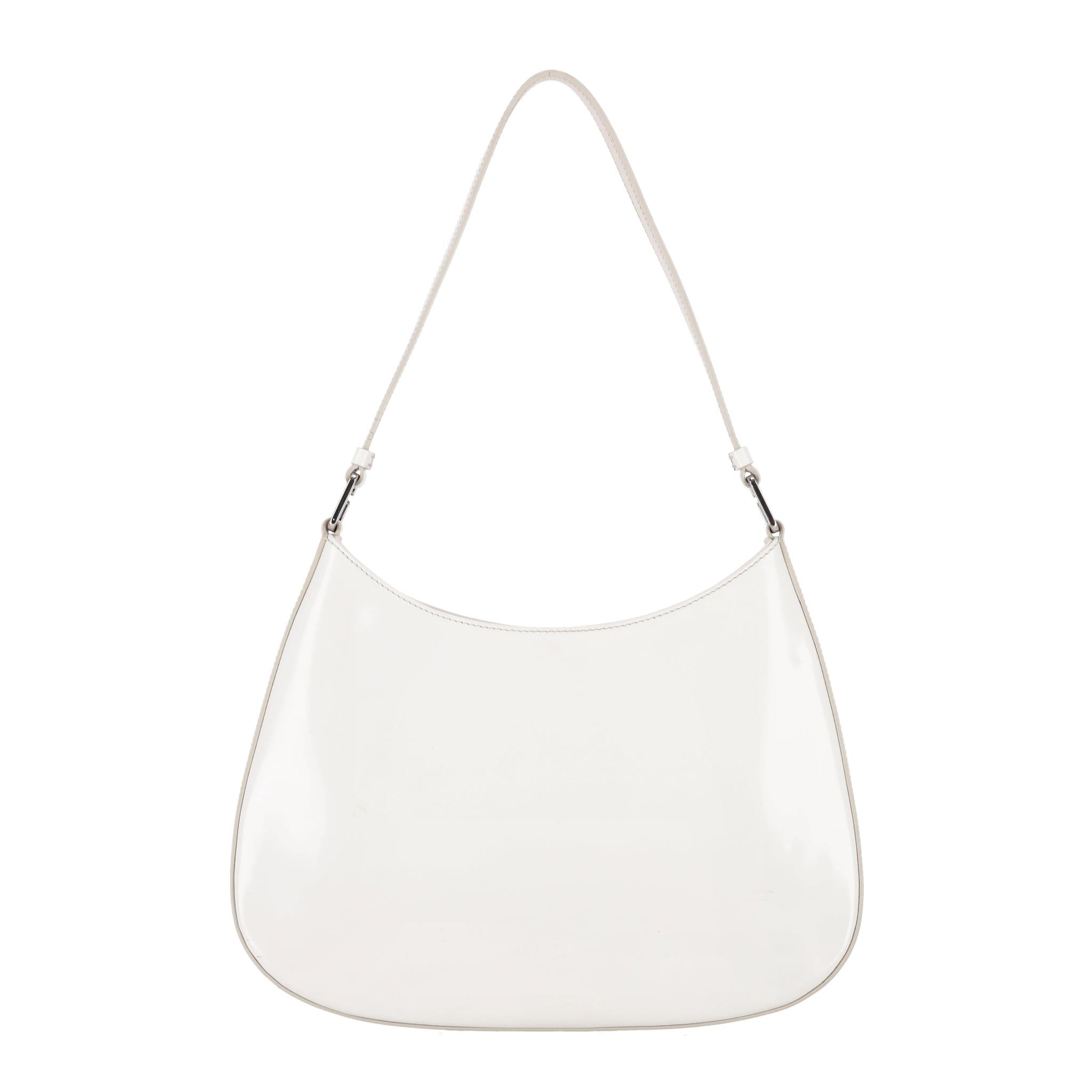 We Adore - Prada Cleo Leather Shoulder Bag

White shoulder bag crafted from leather with the brand's signature enamel triangle logo to the centre.

Designed with sleek curved lines emphasized by the rounded construction on the bottom and