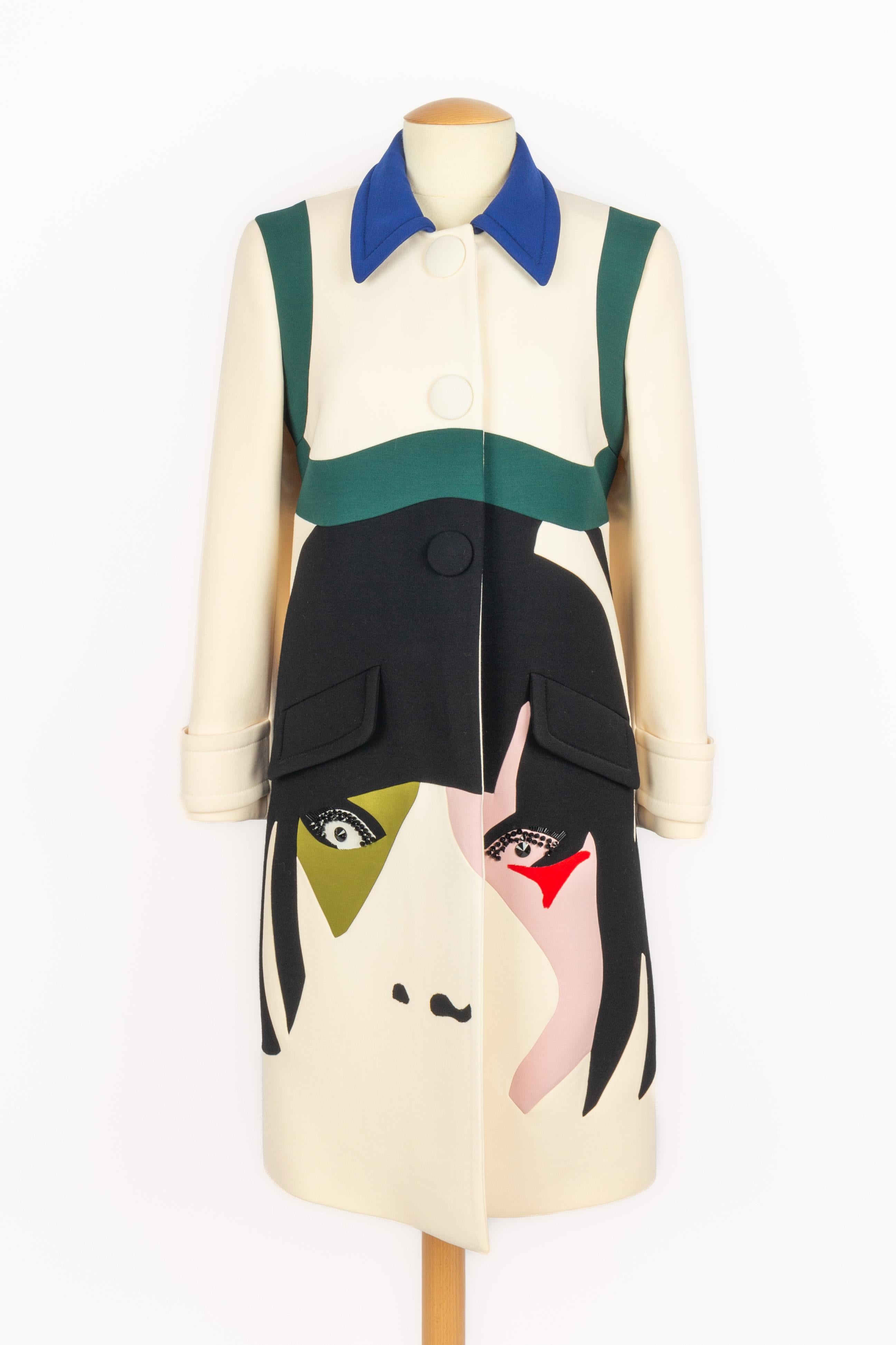 PRADA - (Made in Italy) Patchwork coat with a woman face represented in white, off-white, black, green, and pink tones. Black pearl embroidery. Size 38FR indicated, it fits a 36FR. 2014 Spring-Summer Collection under the artistic direction of