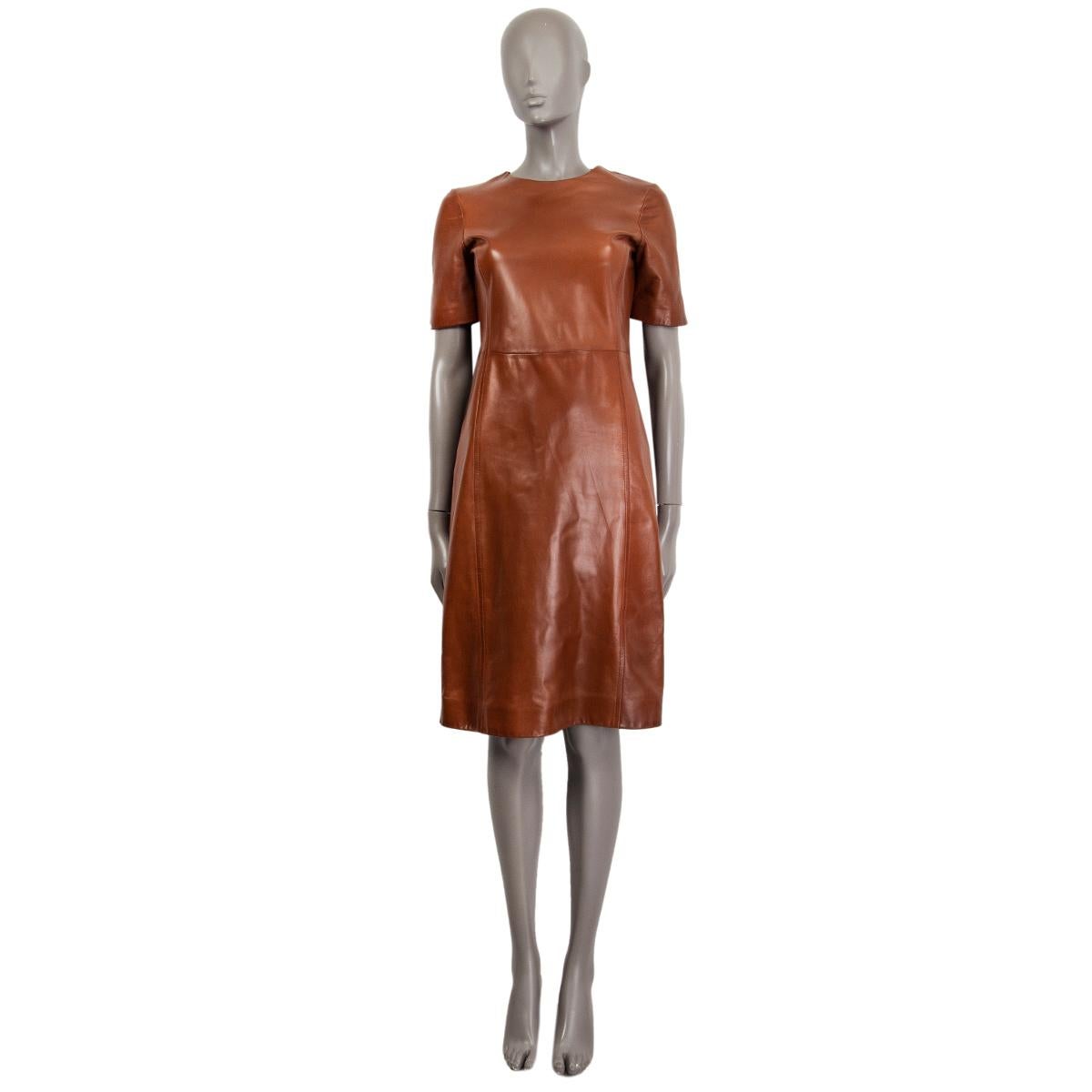 100% authentic Prada short-sleeve. shift dress in cognac brown lambskin. Lined in cupro (93%) and elastane (7%). Opens with a zipper on the back. Has been worn once and is in excellent condition. 

Measurements
Tag Size	42
Size	M
Shoulder Width	38cm