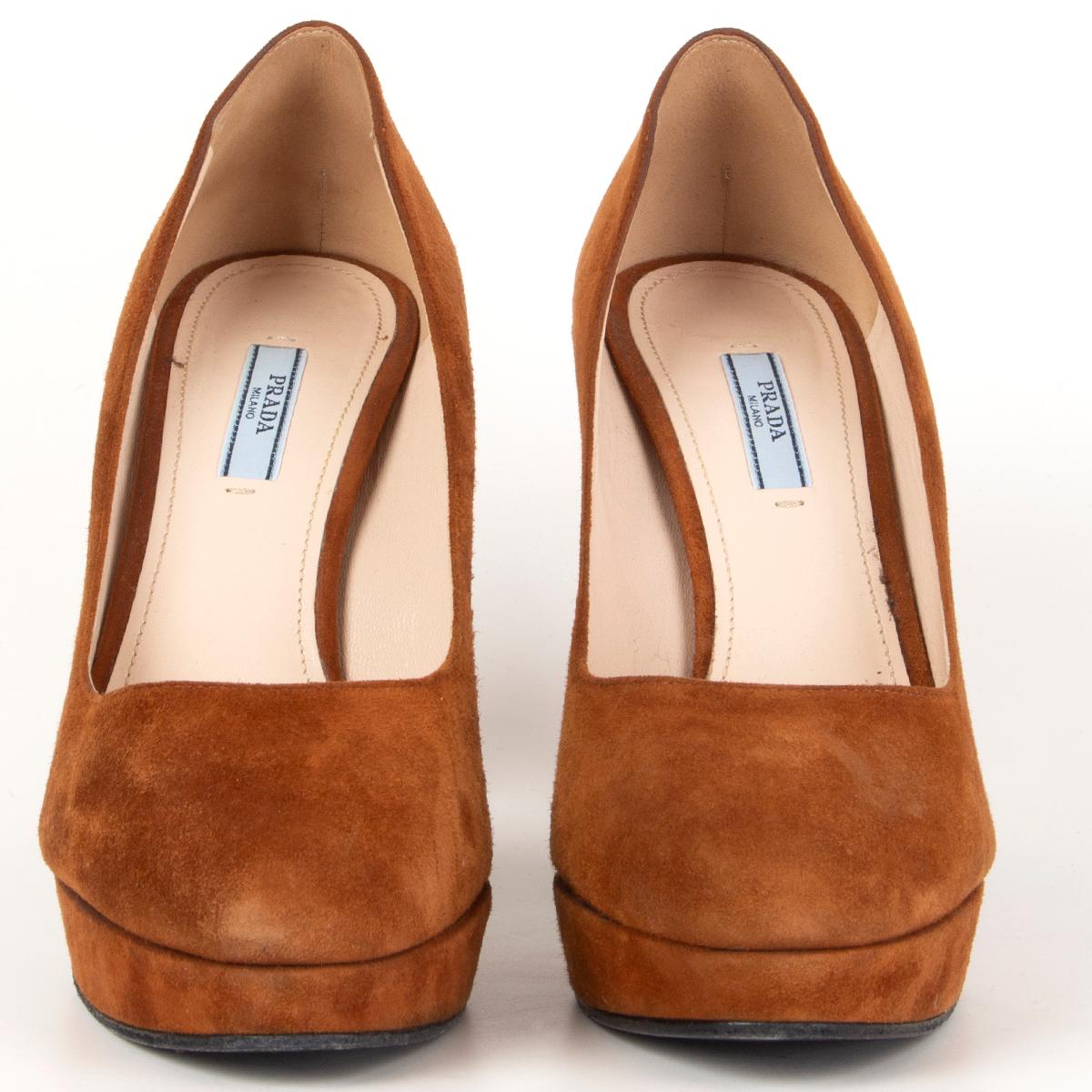 100% authentic Prada platform pumps in cognac suede. Have been worn and are in excellent condition. 

Measurements
Imprinted Size	40.5
Shoe Size	40.5
Inside Sole	27cm (10.5in)
Width	8cm (3.1in)
Heel	12cm (4.7in)
Platform:	2.5cm (1in)

All our