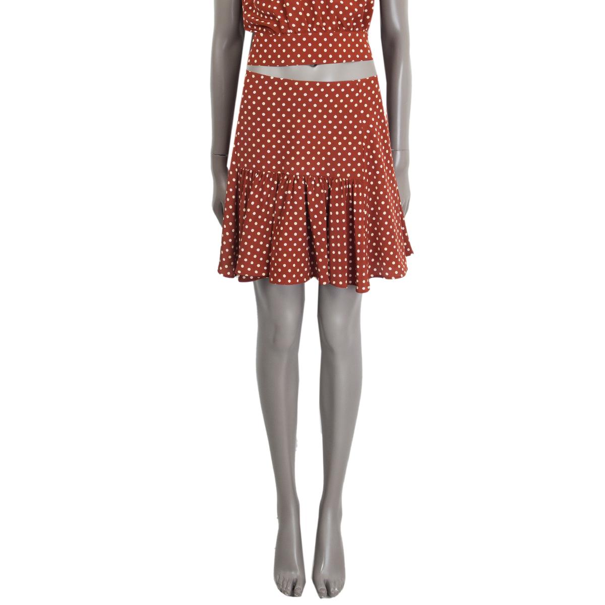 100% authentic Prada flared polka dot mini skirt in cognac and off-white silk (100%). Opens with a zipper on the side. Has been worn and is in excellent condition. Comes with matching top in separate listing. 

Measurements
Tag Size	42
Size	M
Waist