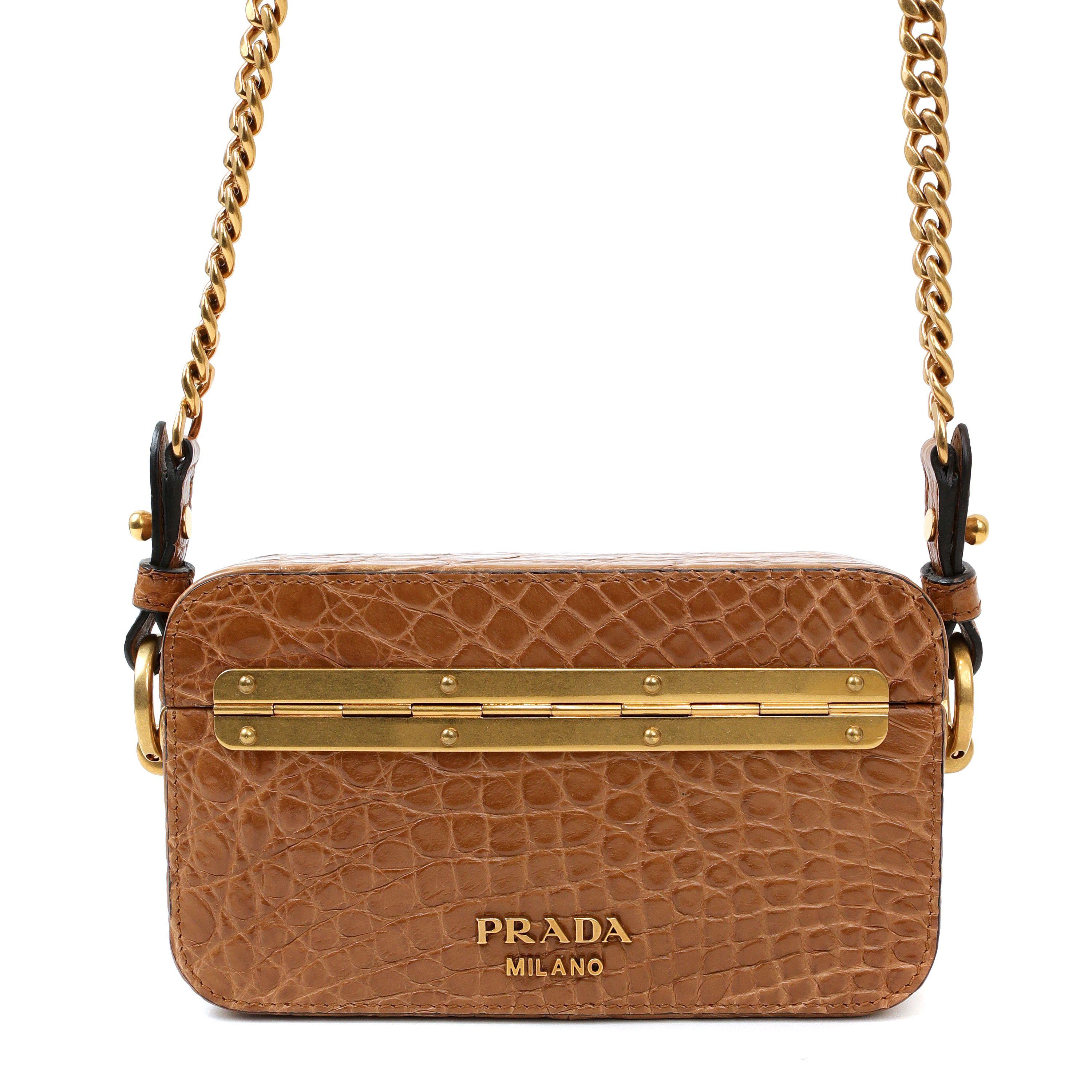 This authentic Prada Cognac Crocodile Crossbody is in pristine condition.  Warm cognac brown crocodile hard case bag with hinged top.  Gold tone chain strap. Dust bag included.


PBF 13763
