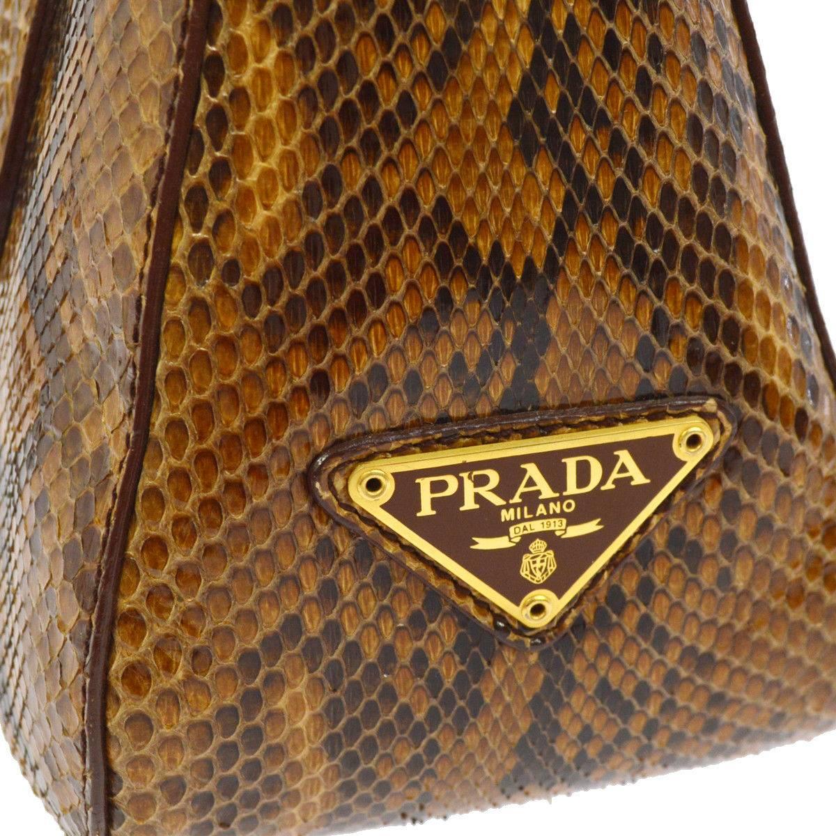Prada Cognac Snakeskin Top Handle Satchel Evening Bag with Shoulder Strap Bag

Snakeskin (Python)
Woven lining
Gold tone hardware
Made in Italy 
Handle drop 4