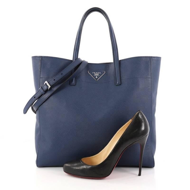 This authentic Prada Convertible Soft Shopping Tote Saffiano Leather Medium exudes a stylish and industrial design made for everyday excursions. Crafted in blue saffiano leather, this roomy tote features dual-flat leather handles, Prada logo at the