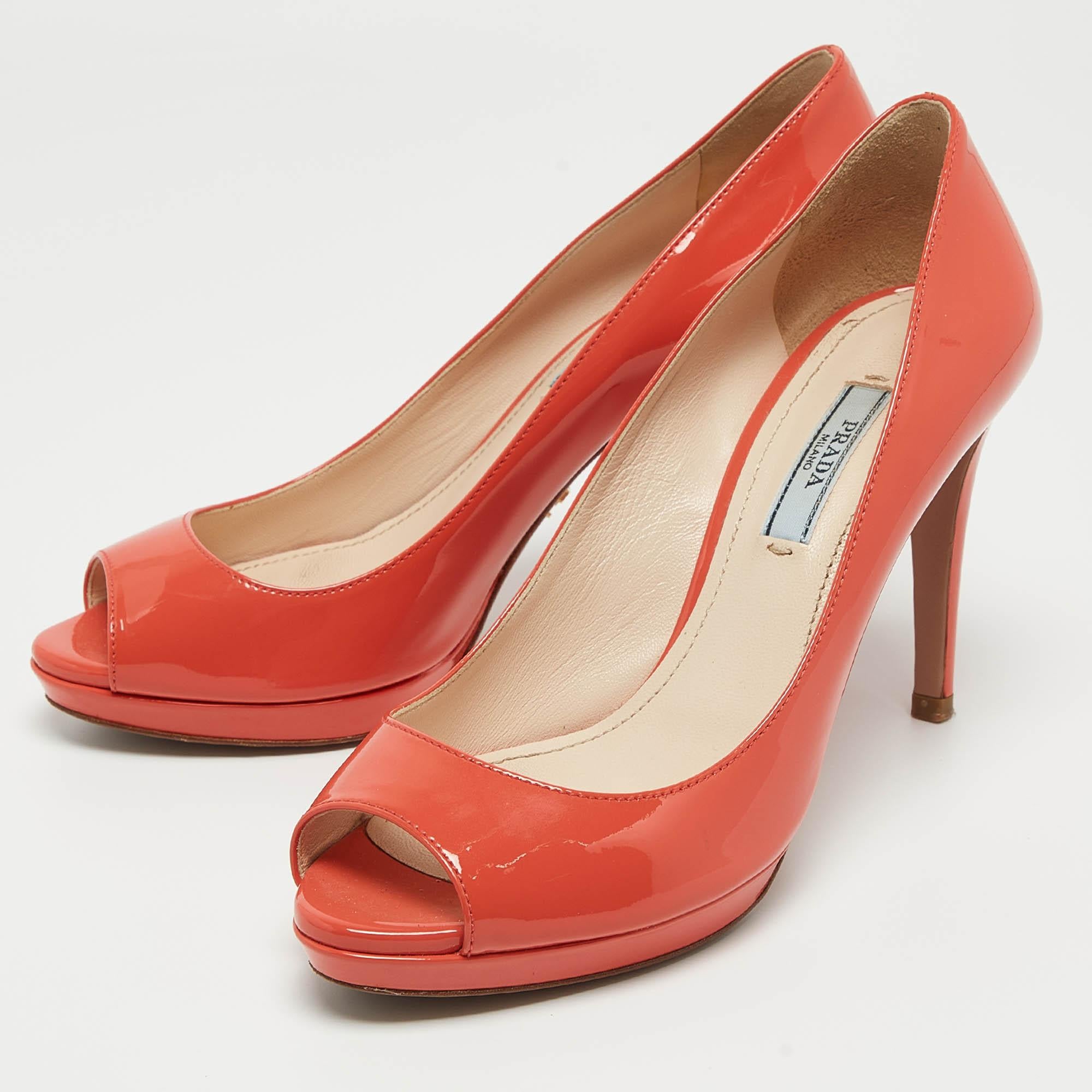 What beauty are these pumps from Prada They are beautifully crafted from coral pink patent leather in a peep toe style complete with 9.5 cm heels.