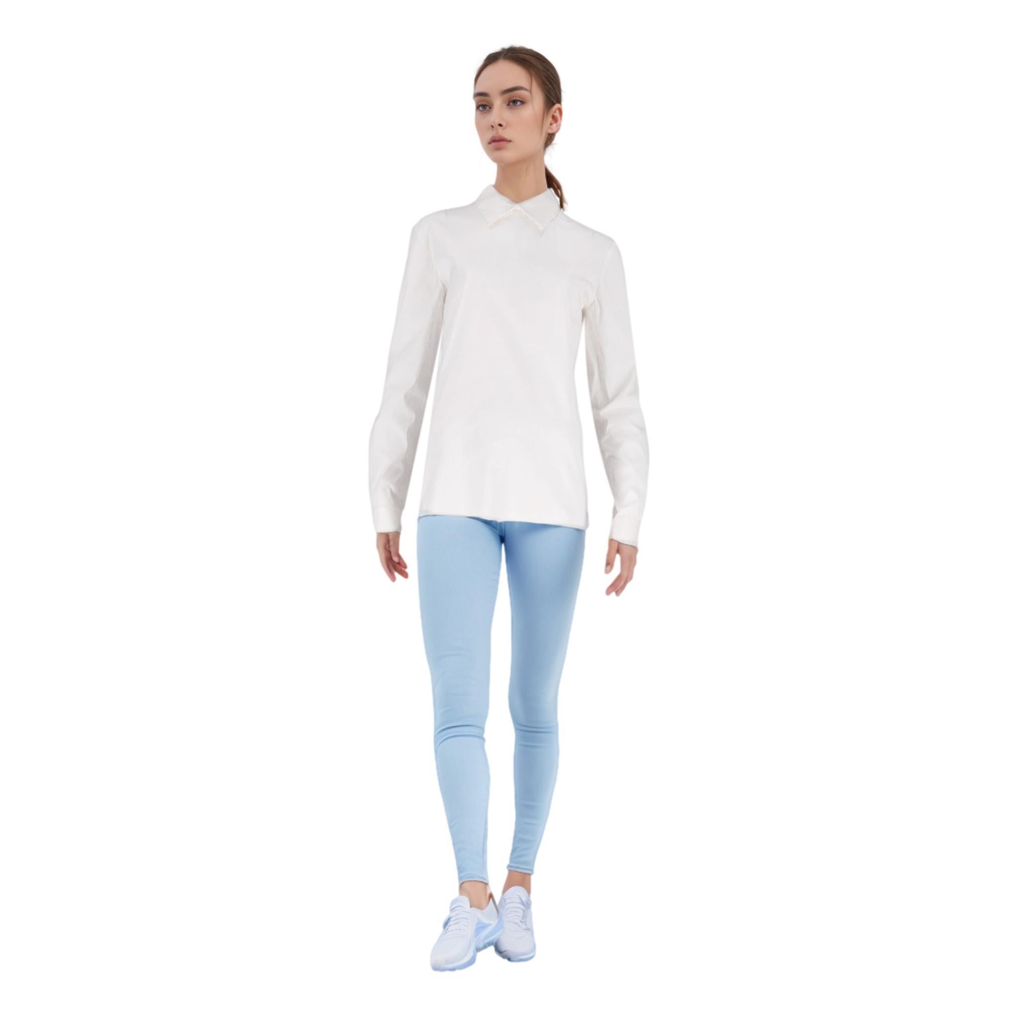 Prada Cotton Shirt With Zip-Up To Rear

White top crafted from cotton with buttonless design.

Featuring silver zip fastening along the back add a classic collar.
Rrp Approx. £900

Size – 46IT

Condition – Very Good (Minor, hardly visible