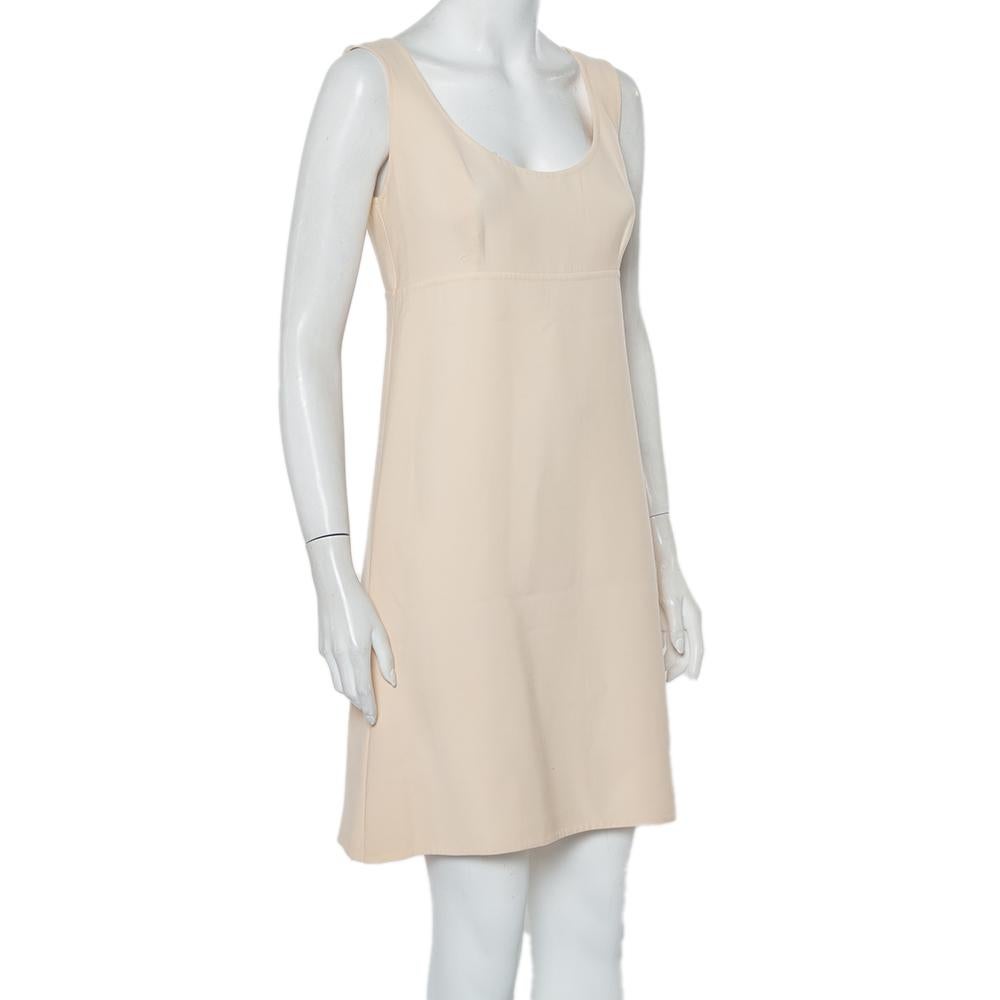 Elegant and modern are two words that pretty much define this Prada dress. It is a beautiful creation made from cotton fabric in a cream hue. The sleeveless dress is cut to the perfect shape and will look best styled with boots and a cardigan.

