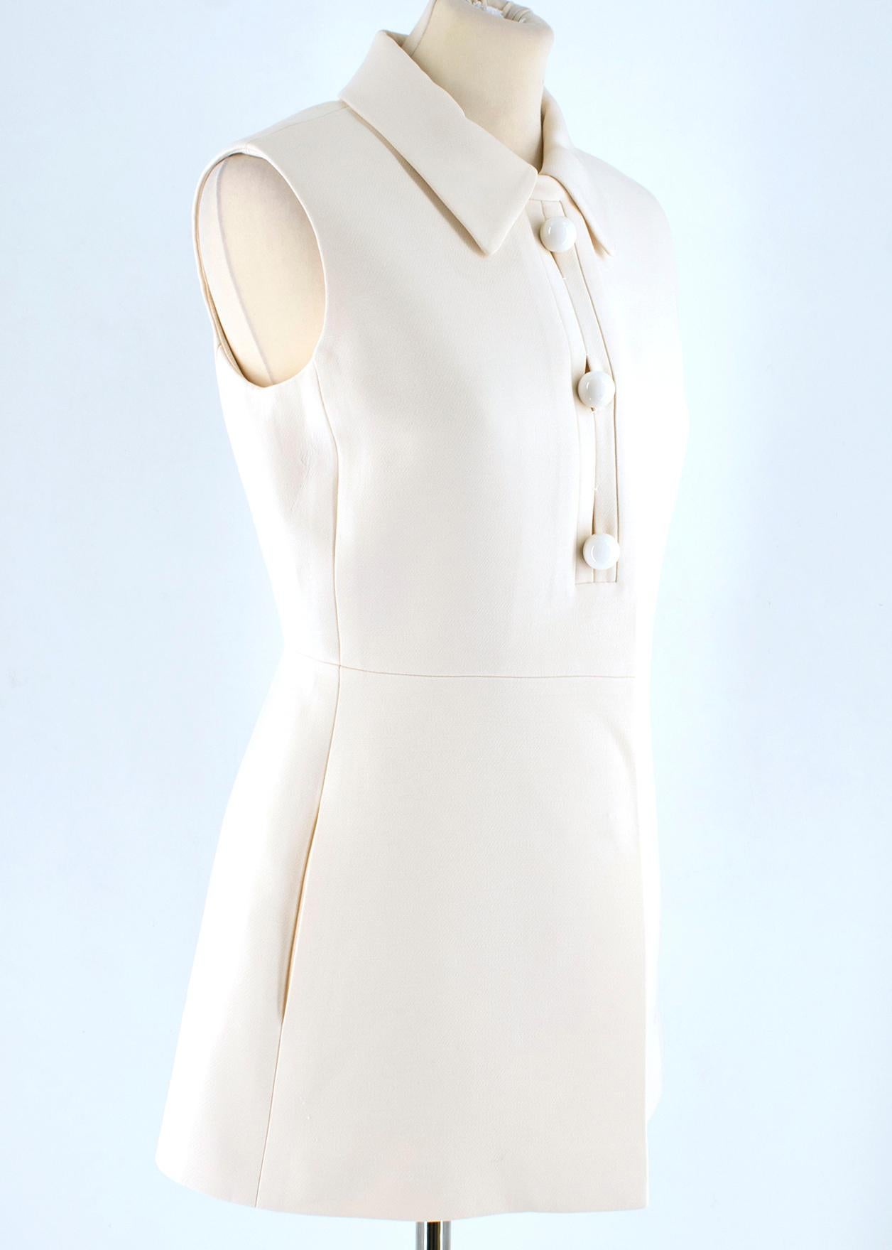 Prada Cream Sleeveless Wool Gilet

- beige wool gilet 
- sleeveless
- three buttons to the front and hidden push buttons closure
- lined

Please note, these items are pre-owned and may show some signs of storage, even when unworn and unused. This is