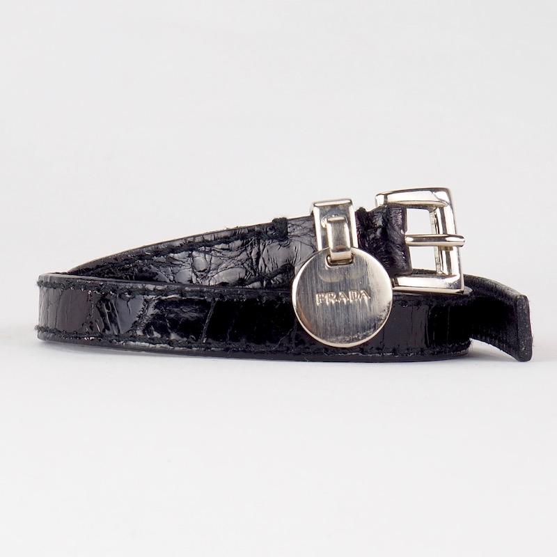 A very cool Prada twice wrap around bracelet in crocodile that fastens with a silver buckle and safety loop with disc.