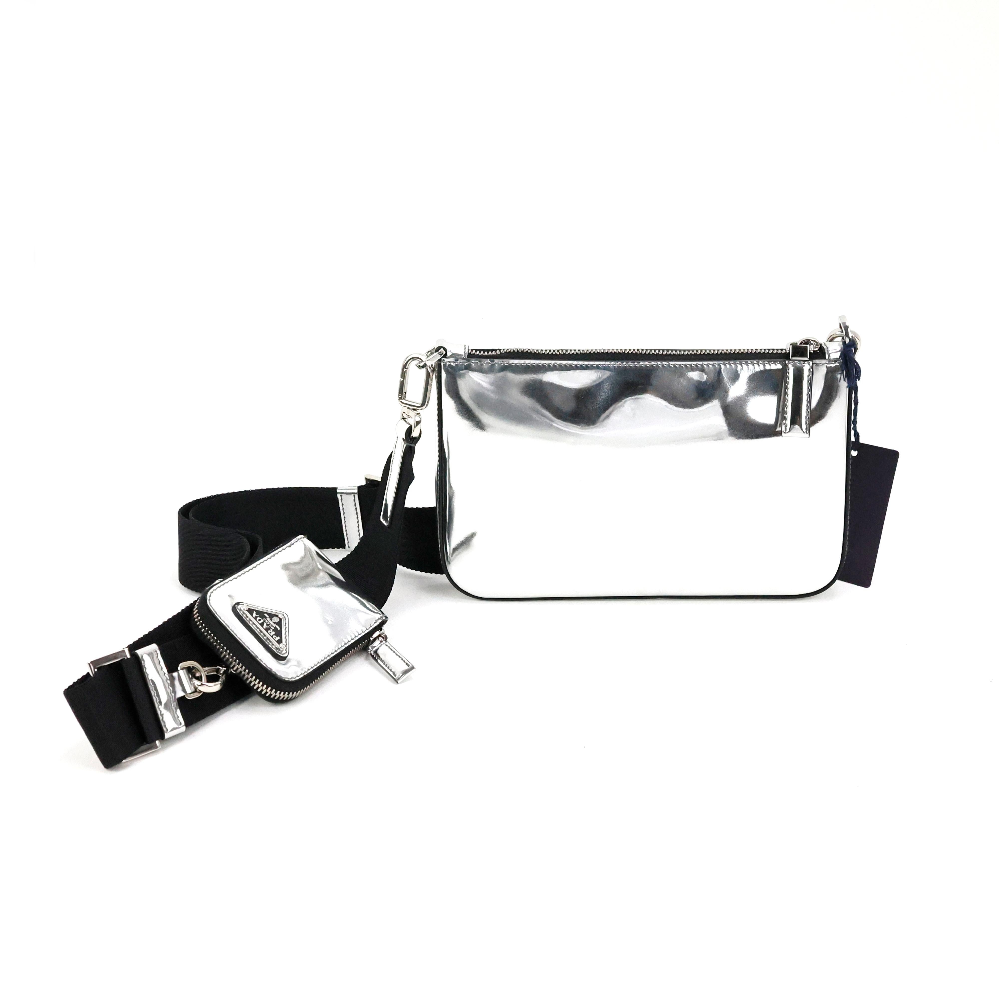 Prada crossbody bag in spazzolato leather color silver.

Condition:
Really good. To note: only few small flaws on leather, please check the pictures.

Packing/accessories:
Box, tag, dustbag, authenticity card.

Measurements:
22cm x 14cm x 3cm.