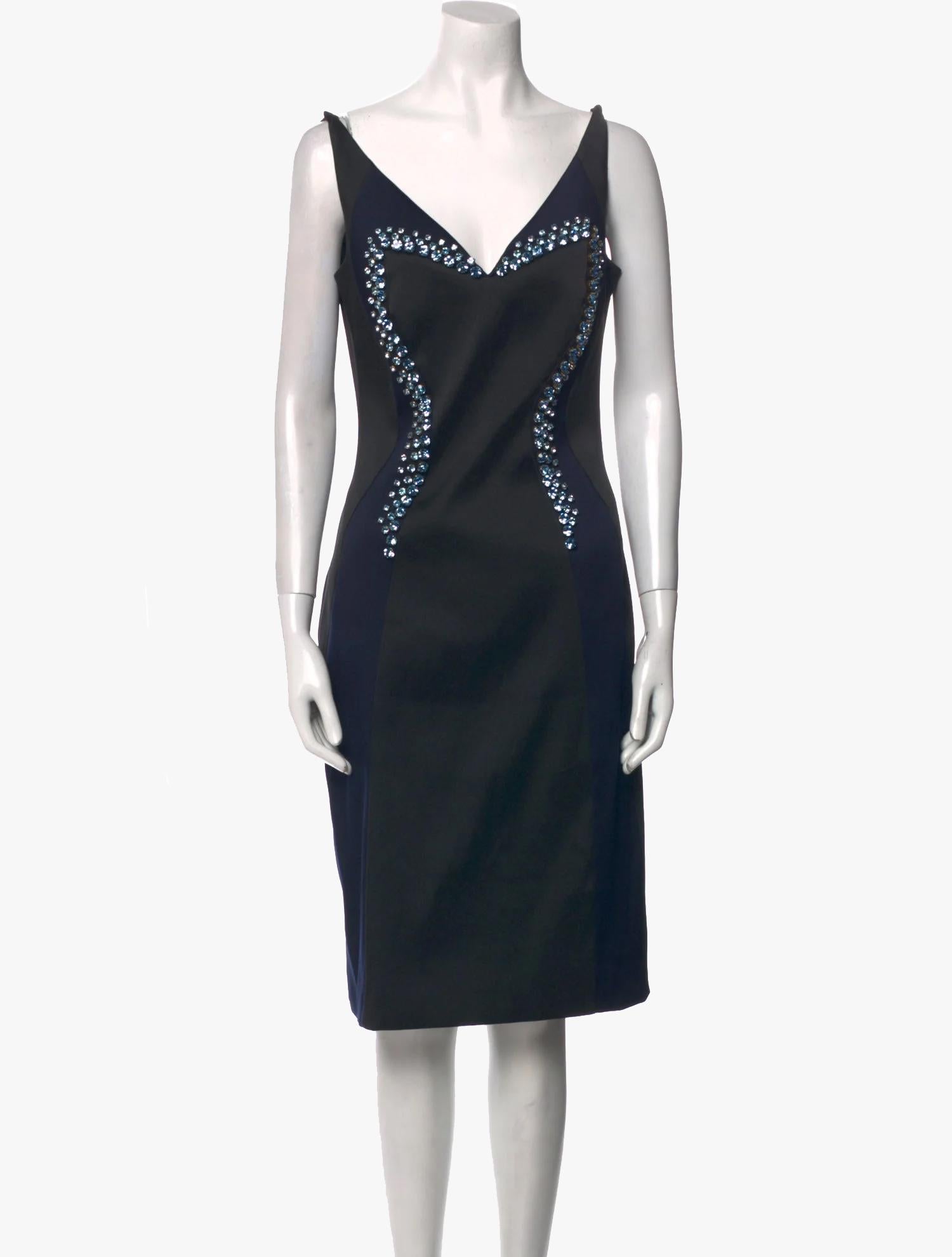 Prada crystal embellishments dress from the Spring/Summer 2012 Collection

Sleeveless with V-Neck

Concealed Zip Closure at Back

Size: M  US8, IT44

Bust: 33″ / 83,8 cm

Waist: 26″ / 66 cm

Hip: 35″ / 89 cm

Length: 39.5″ / 100,4 cm

Fabric: 89%