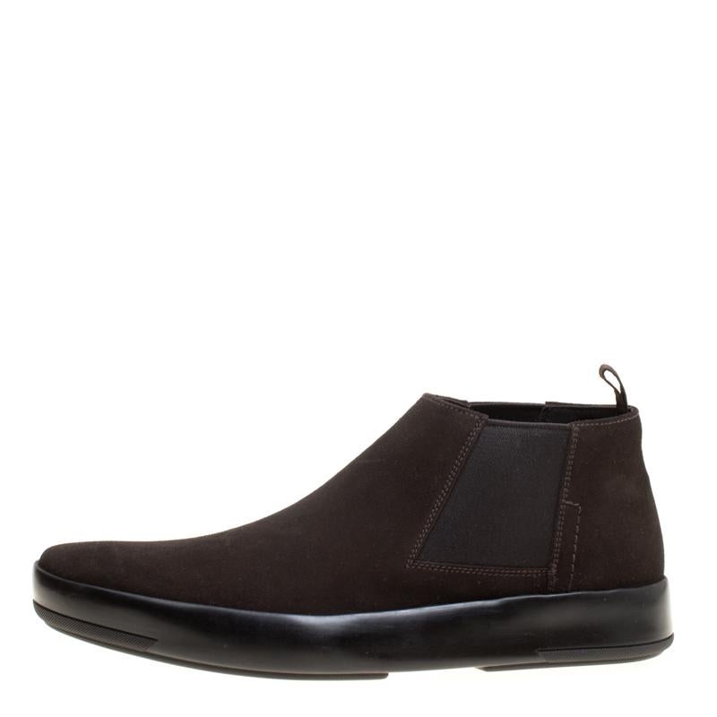 These Chelsea boots from Prada are sure to make you look suave, smart and very stylish! The dark brown boots are crafted from suede and feature round toes, elasticized side panels comfortable leather lined insoles and tough rubber soles. Pair them