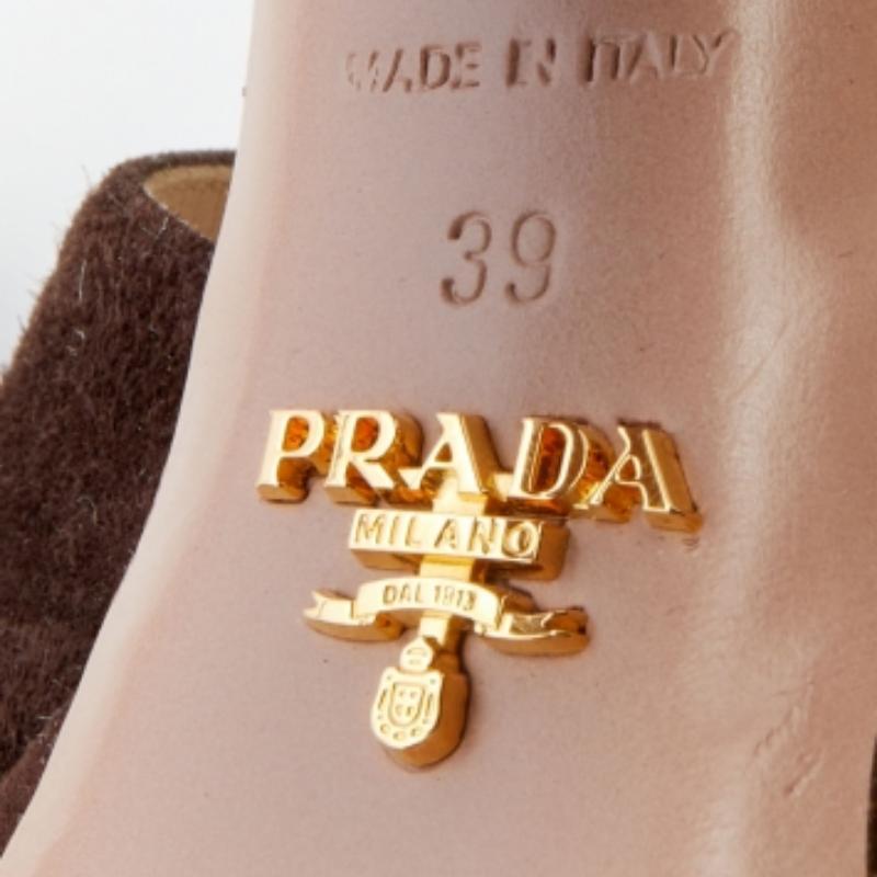 These sandals from Prada are a perfect blend of fashion and comfort! These platform sandals are crafted from suede and feature an open-toe silhouette. They come equipped with leather-lined insoles, ankle straps, and 12.5 cm block heels.