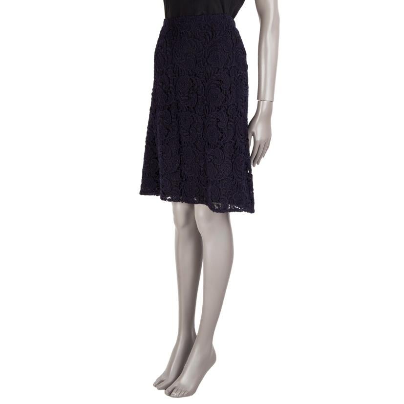 Prada floral lace skirt in dark blue wool (90%) and polyester (10%). Closes with concealed snaps and a hook on the left side. Lined in black viscose (probably as content tag is missing). Has been worn and is in excellent condition.

Tag Size 44
Size