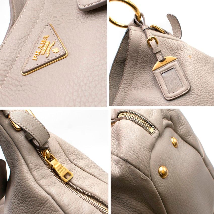 Prada Deerskin Leather Large Shoulder Tote

- Large, slouchy soft deerskin grained leather
- Shoulder bag
- Large & spacious
- One rolled leather shoulder strap
- Luggage tag bag charm
- Decorative chunky side zips
- Leather patch & metal branding