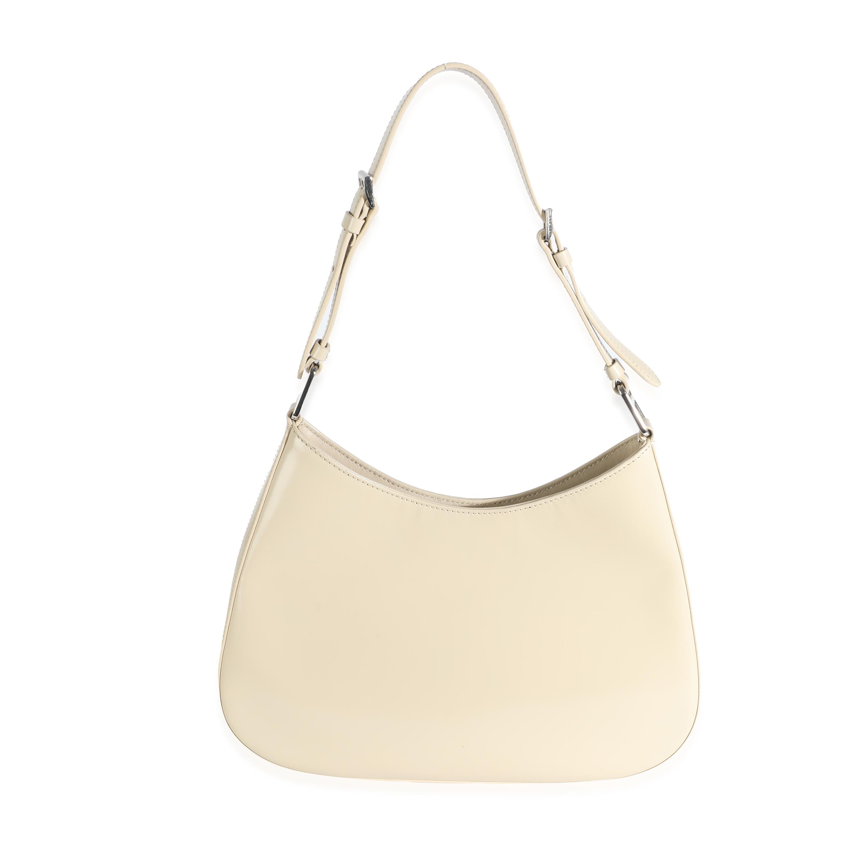 Listing Title: Prada Desert Beige Brushed Calfskin Cleo Shoulder Bag
SKU: 144072
Condition: Pre-owned 
Condition Description: Reimagining a classic design from the ‘90s, the Cleo bag from Prada epitomizes pared-back luxury. Soft curved lines and a