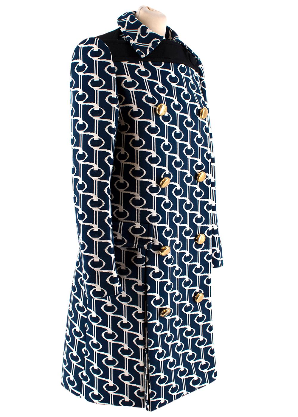 Prada Navy Double Breasted Key Jacquard Coat 

- Zipped Cuffs
- Black Buttoned Panel 
- Point Collar 
- Side Slit 
- Gold Tone Metal Buttons 

Materials
-100% Polyester 
- Dry Clean Only

Made in Italy   
 
Shoulders: 38cm
Length: 103cm
Sleeves: