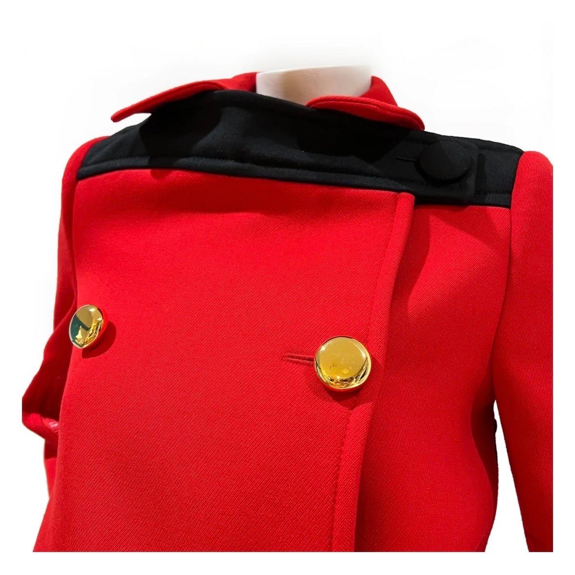 Double Breasted Jacket by Prada 
Spring 2019 
Red 
Black yoke across the front and back of the shoulders  
Double breasted 
Gold buttons on front of jacket 
Zipper cuffs   
Structure Shoulders
Fabric Composition; 100% Virgin Wool, 100% Viscose