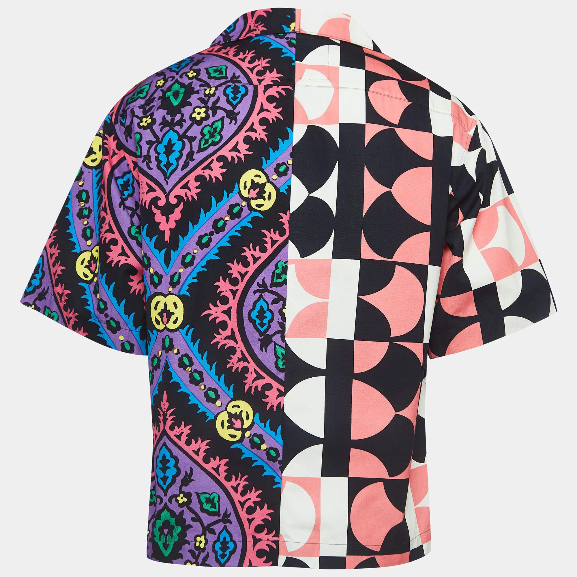 Embrace vibrant sophistication with the Prada shirt. Crafted with premium cotton, it boasts a striking array of colors in an intricate print, marrying contemporary style with luxurious comfort for a statement piece that exudes refined elegance.

