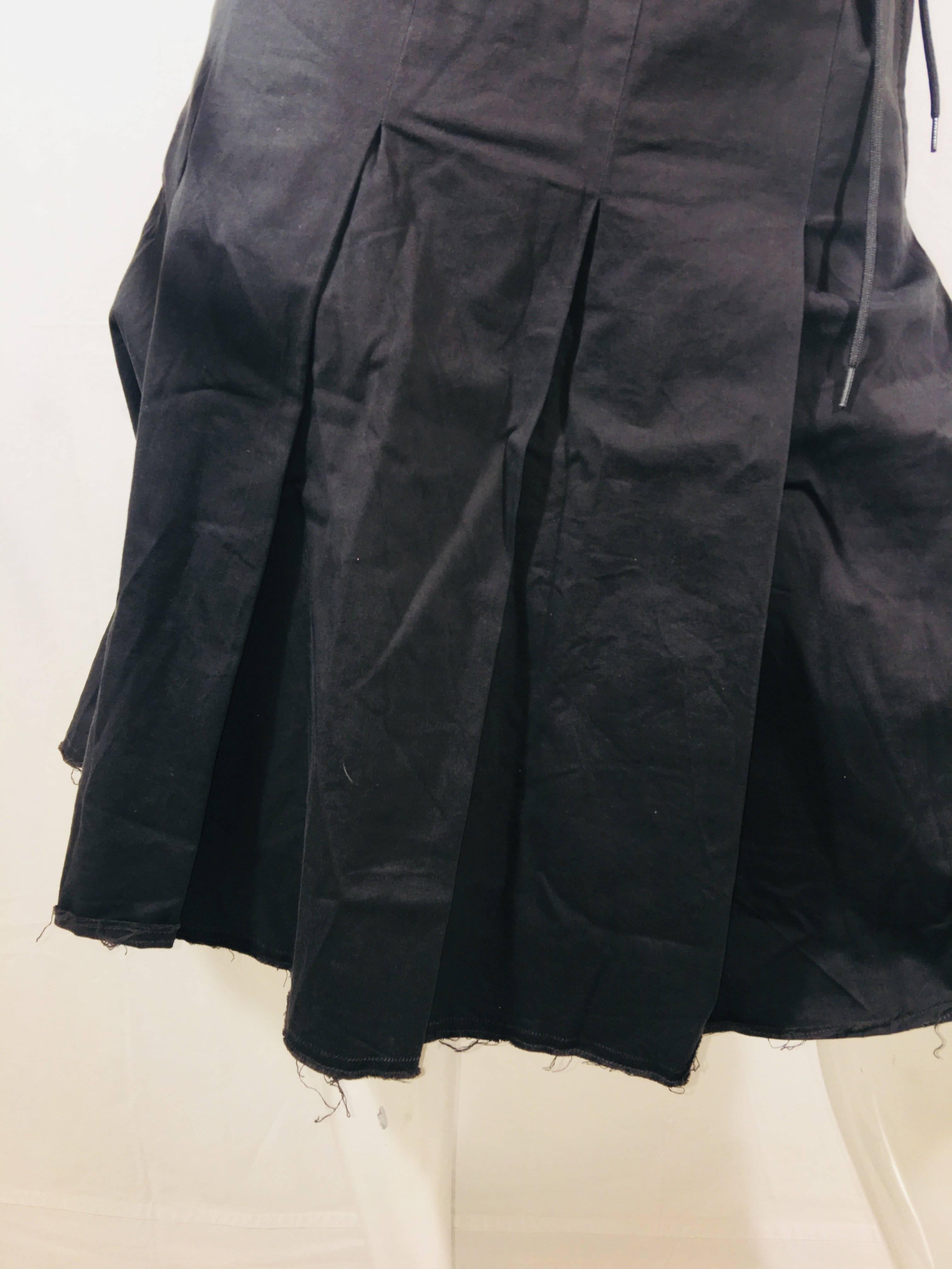 Prada A-Line Pleated Skirt with Drawstring Waistline.