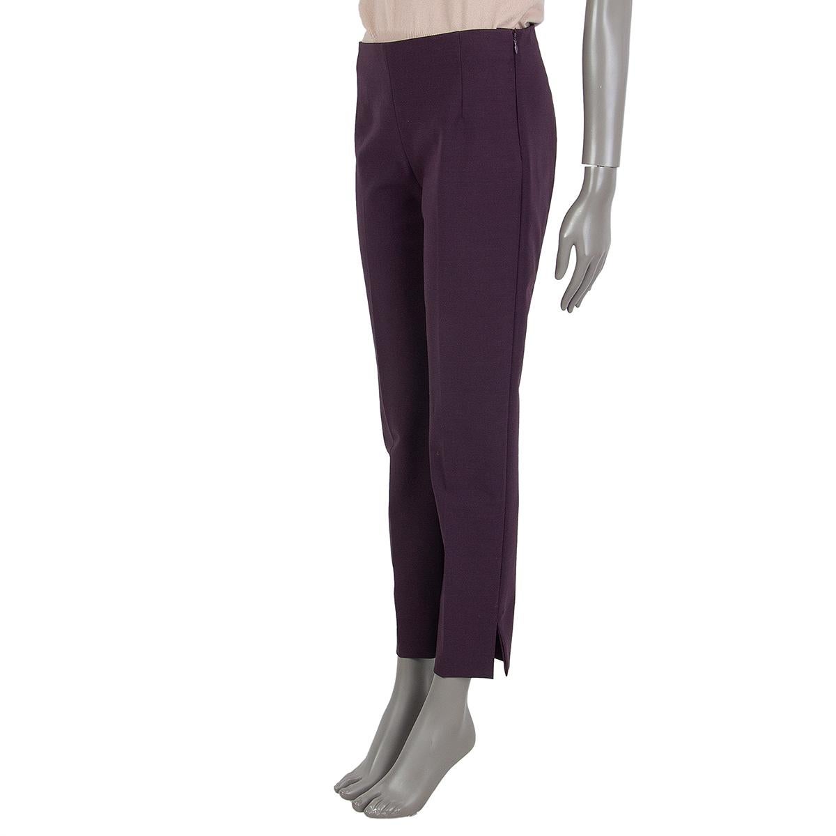 100% authentic Prada tapered pants in eggplant virgin wool (66%), polyester (20%), nylon (10%) and elastane (4%). Closes on the side with a concealed zipper. Unlined. Have been worn and are in excellent condition. 

Measurements
Tag