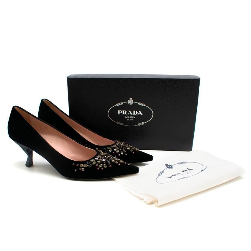 Prada Soft Velvet heels with jewel embellishment, elongated square toe and a slanted kitten heel.

- Pink leather insole 
- Dustbag and box included 
- Made in Italy 

Please note, these items are pre-owned and may show signs of being stored even