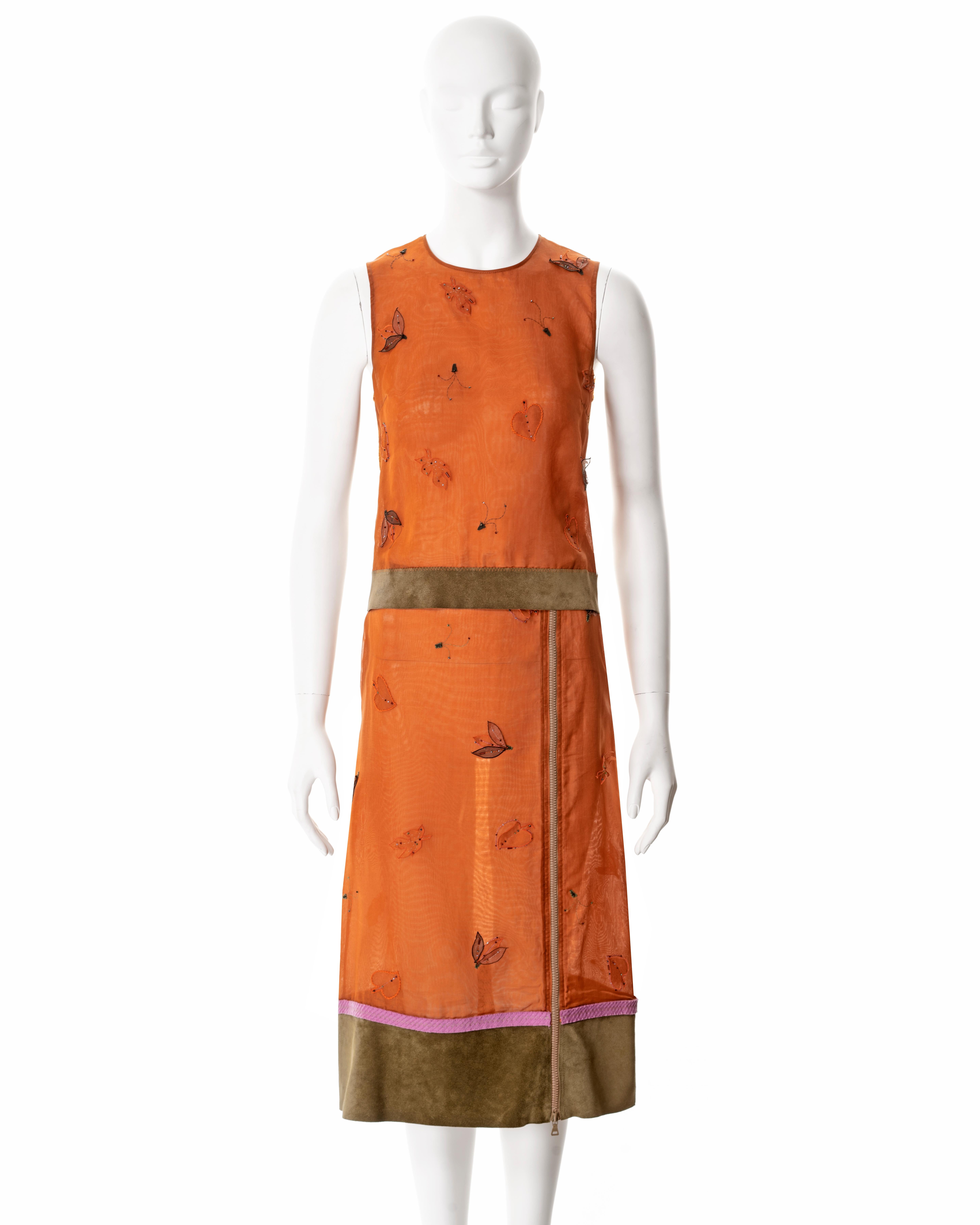 ▪ Prada 2-piece set 
▪ Creative Director: Miuccia Prada 
▪ Sold by One of a Kind Archive
▪ Fall-Winter 1999
▪ Constructed from orange silk organza 
▪ Beaded leaf-shaped organza appliques 
▪ Green suede trim 
▪ Crew-neck tank with mesh back panel 
▪