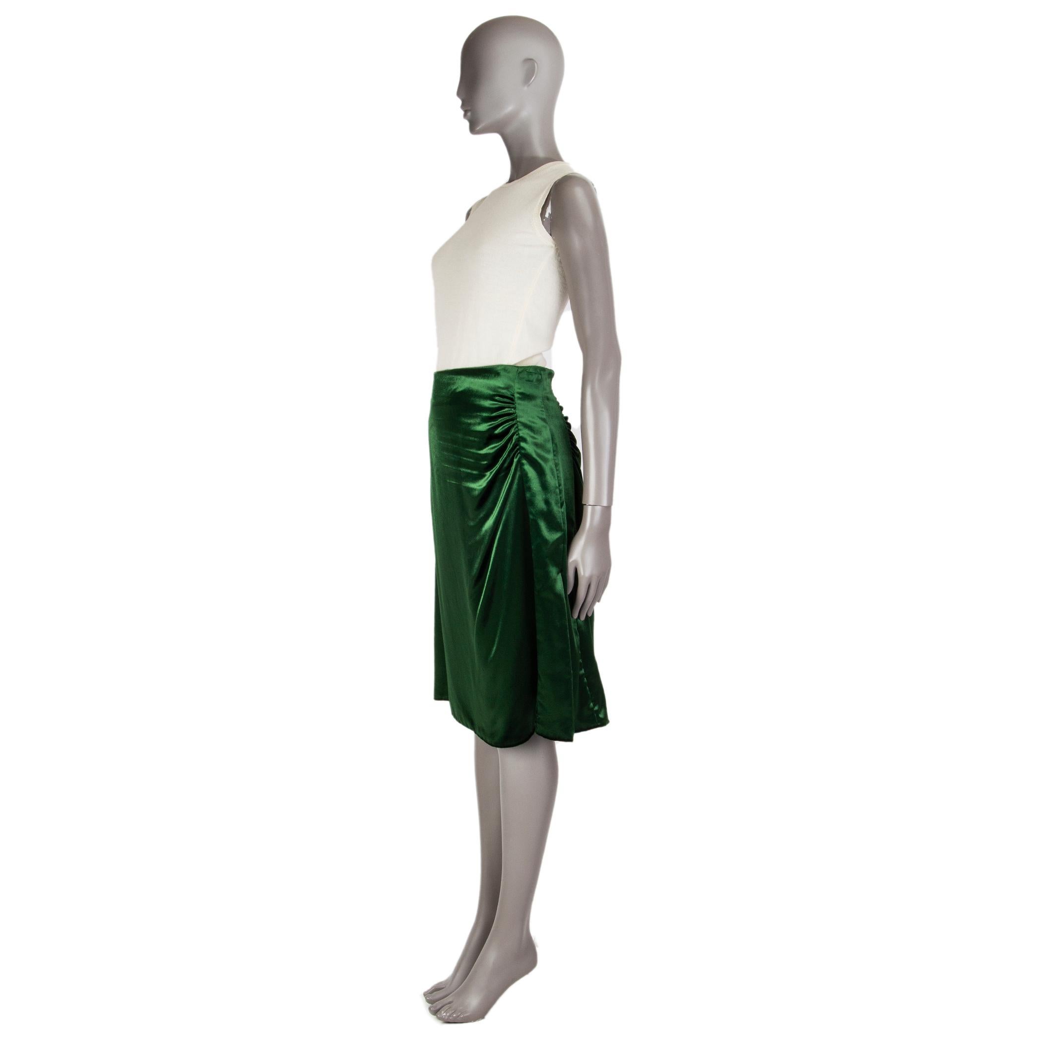 Prada velvet midi skirt in emerald, viscose (80%) cupro (20%). With a cut-out on the left side, draped on the front and back. Closes with a zipper right side. Lining cupro (60%) silk (40). Has been worn and is in excellent condition.

Tag Size