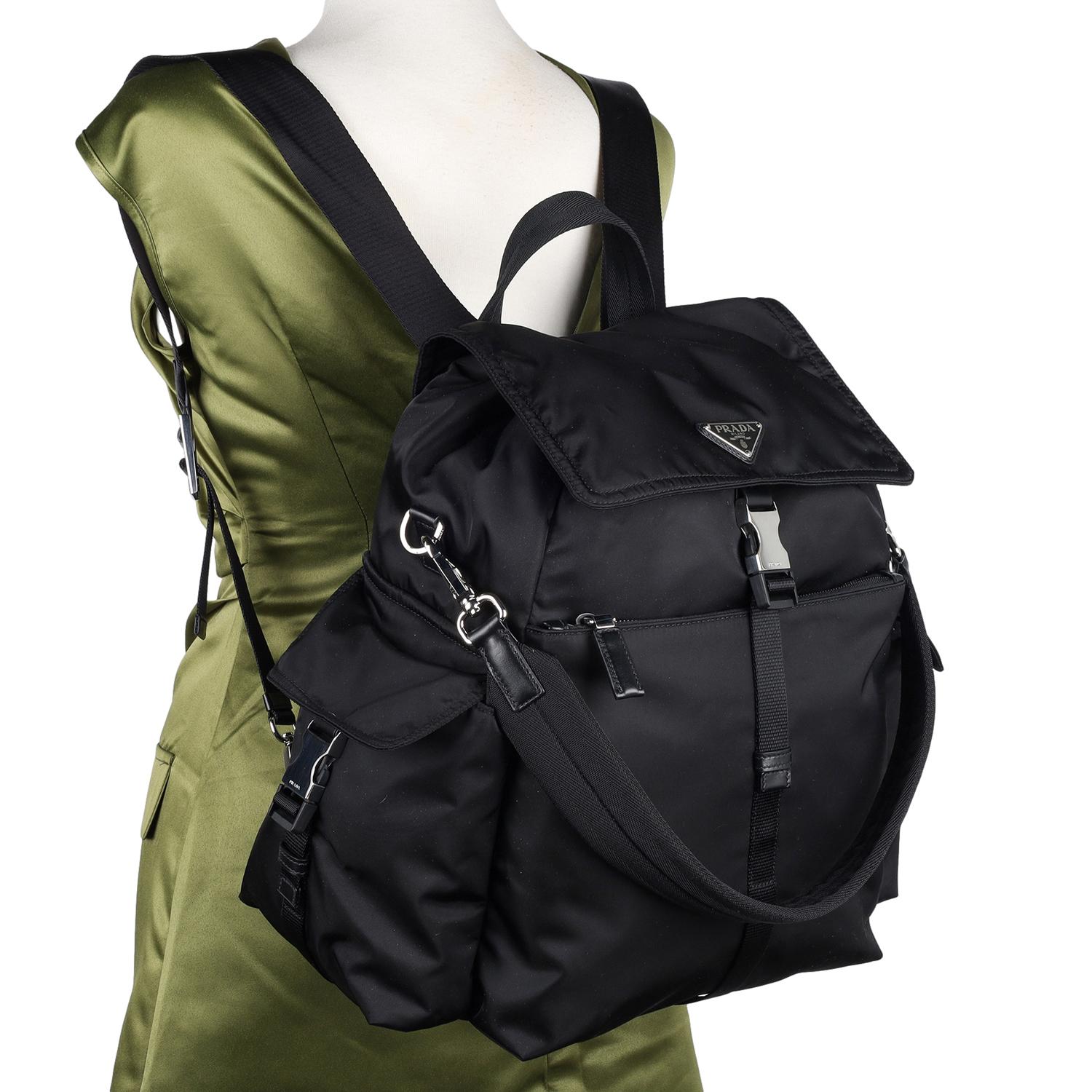 Authentic NEW Prada Explore Re-Nylon Backpack and Shoulder Bag. Features Nylon body with leather trim accents, multi-pocket silhouette with soft lines, detachable handle so that it can also be worn as a shoulder bag. The combination of the backpack