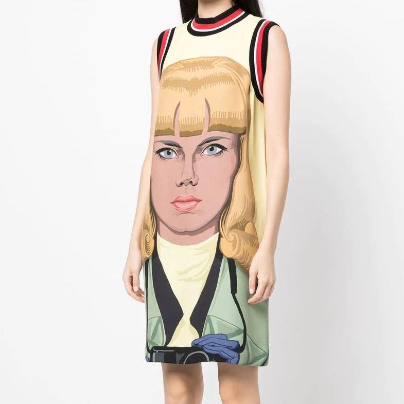 This dress from Prada's Spring 2014 Ready-To-Wear is both striking and elegant. It features a face print of a woman on the front with a relaxed sleeveless silhouette, a thigh-length and a straight hem. This runway piece from Prada is a true